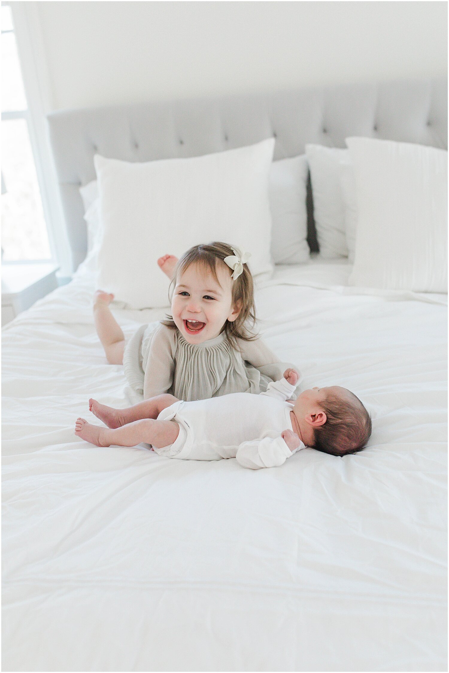 Big sister and baby brother during in-home newborn session. Photos by Westport Newborn Photographer, Kristin Wood Photography.