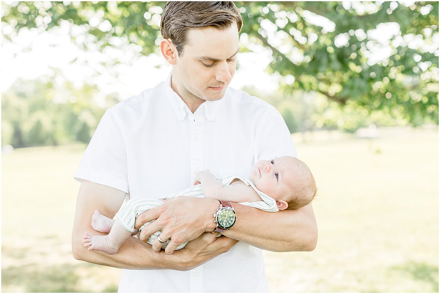 Dad and son at outdoor newborn session at Waveny Park with New Canaan Newborn Photographer, Kristin Wood Photography.