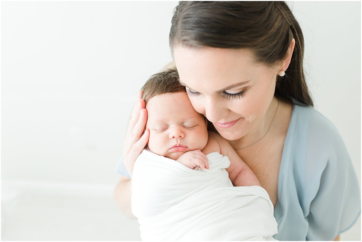 Newborn portraits of Mom and baby boy. Photos by Darien Baby Photographer, Kristin Wood Photography.