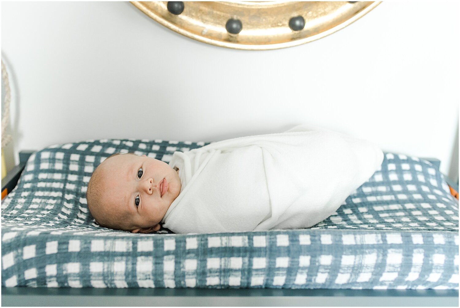Baby boy in nursery for newborn session in New Canaan Home. Photos by Kristin Wood Photography. 