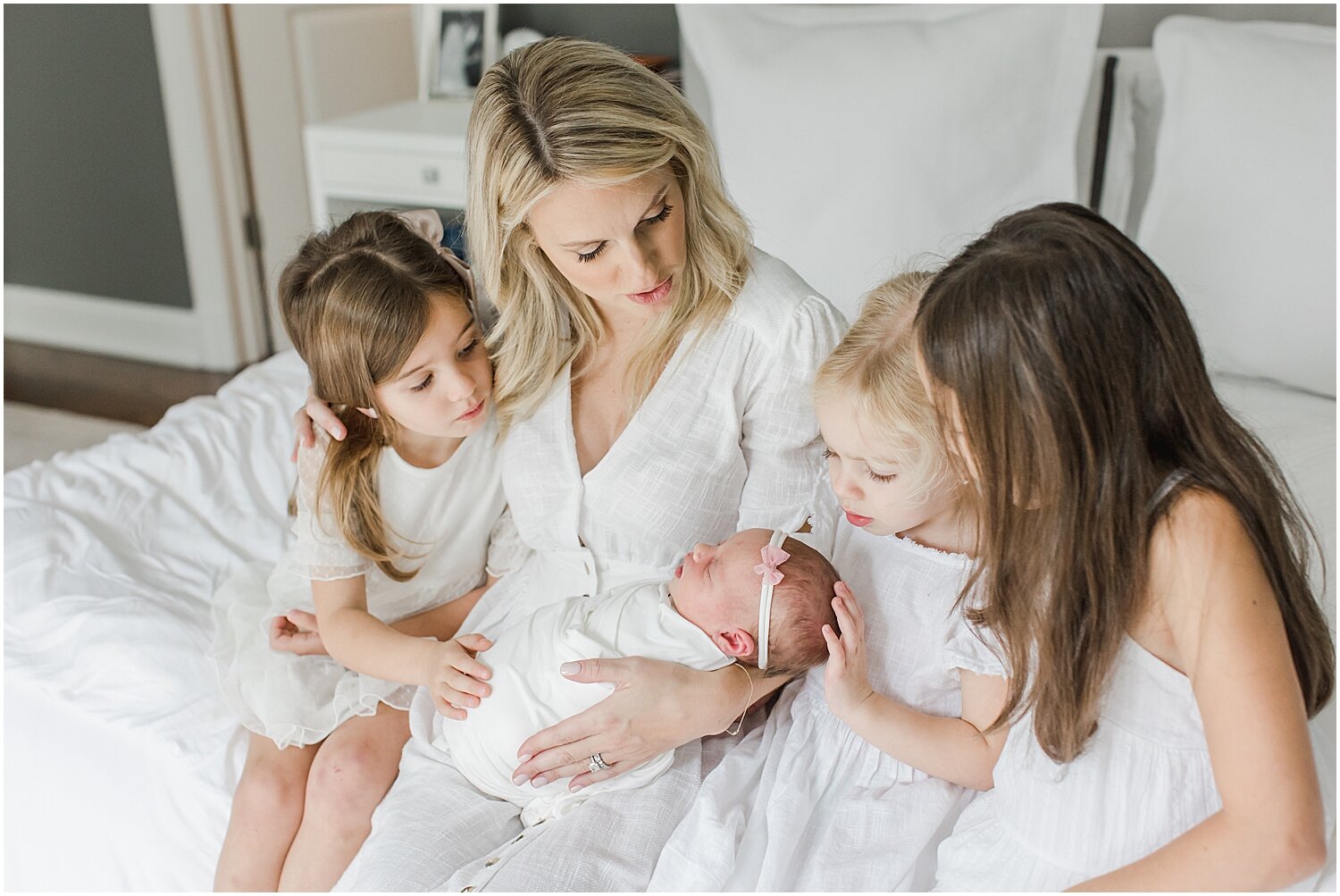 Photo of Mama and her four girls during lifestyle newborn session. Photos by Rye Newborn Photographer, Kristin Wood Photography.
