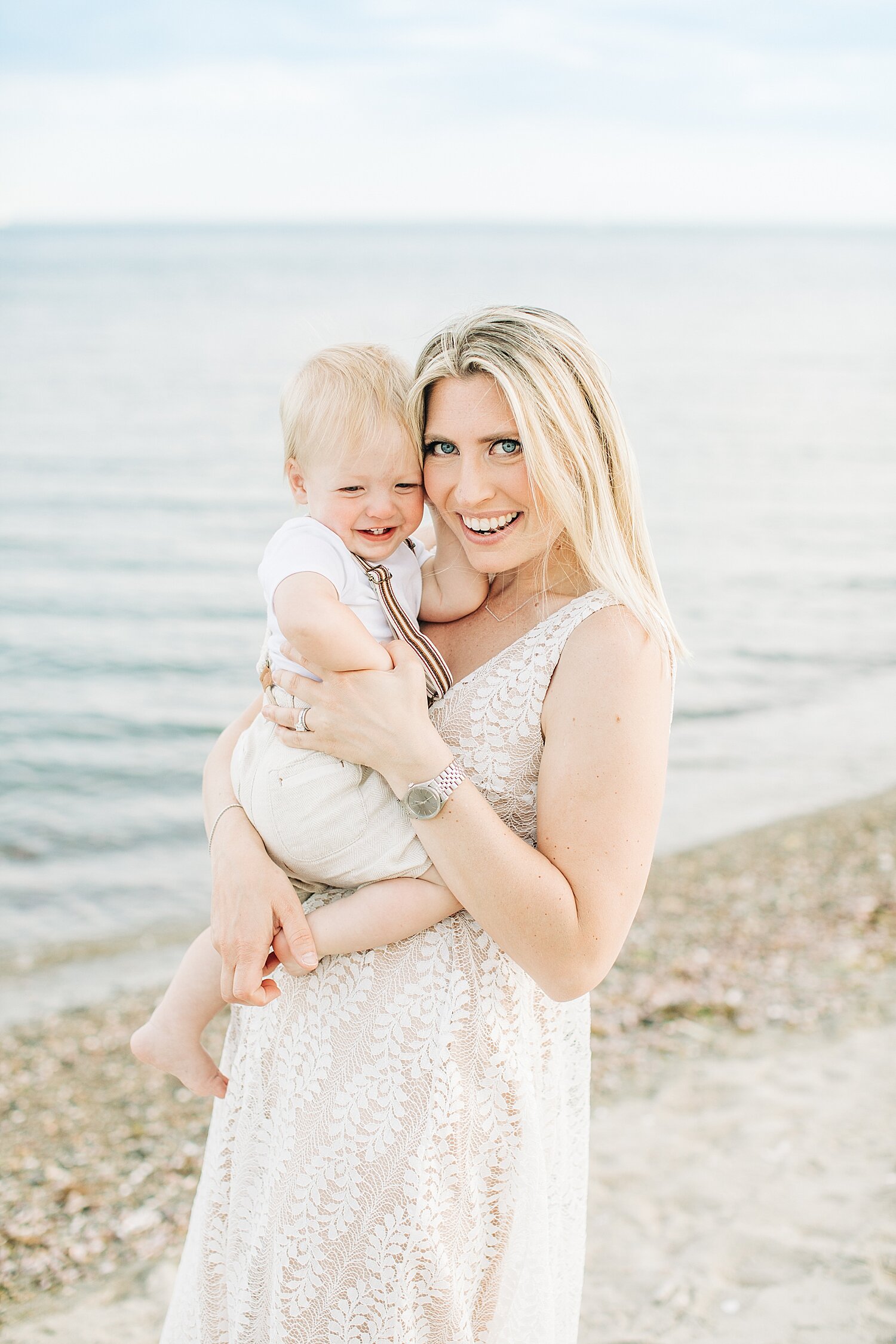 Mom with son on the beach at Sherwood Island. Photos by Kristin Wood Photography.