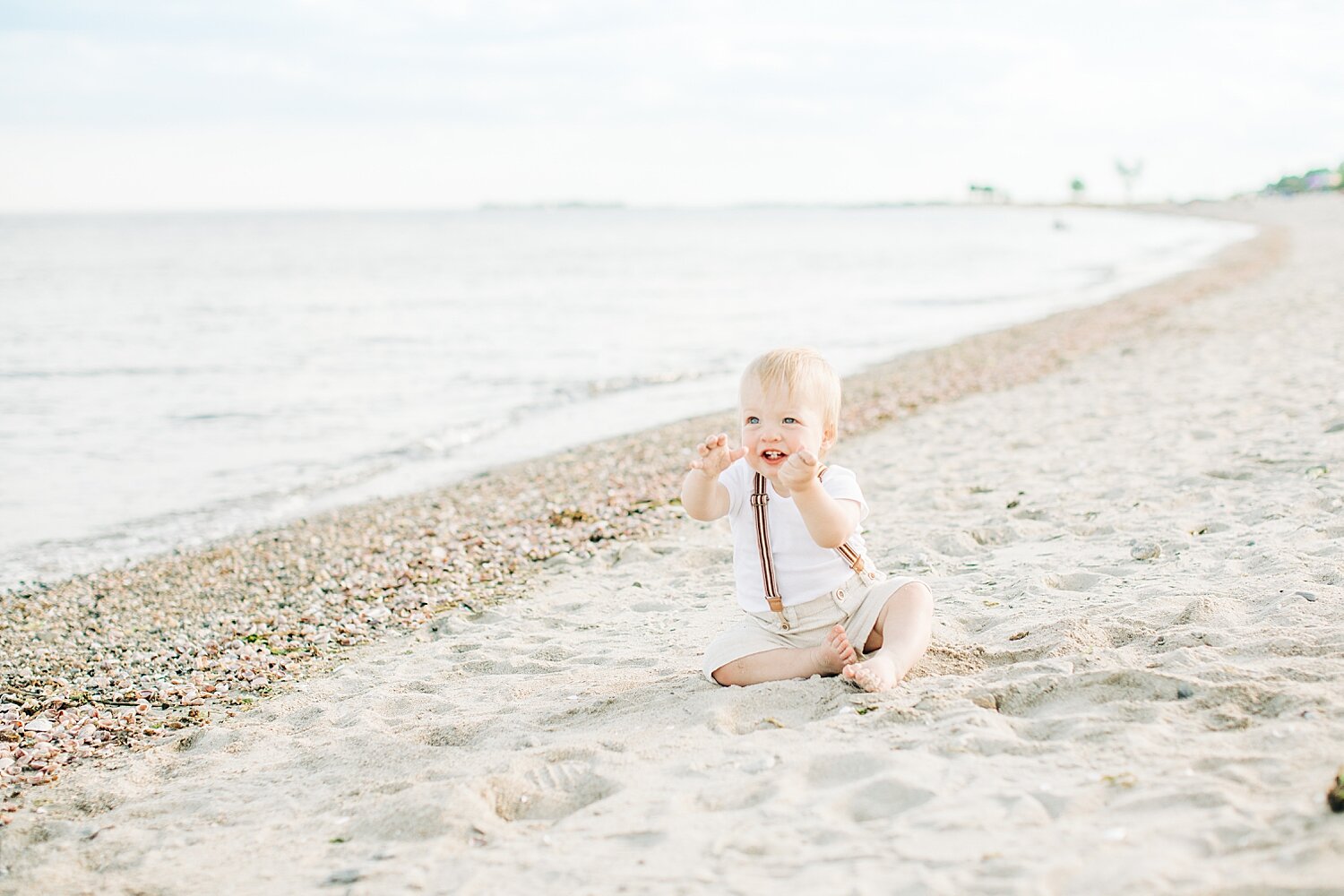 One year old photoshoot on the beach at Sherwood Island. Photos by Connecticut Photographer, Kristin Wood Photography.