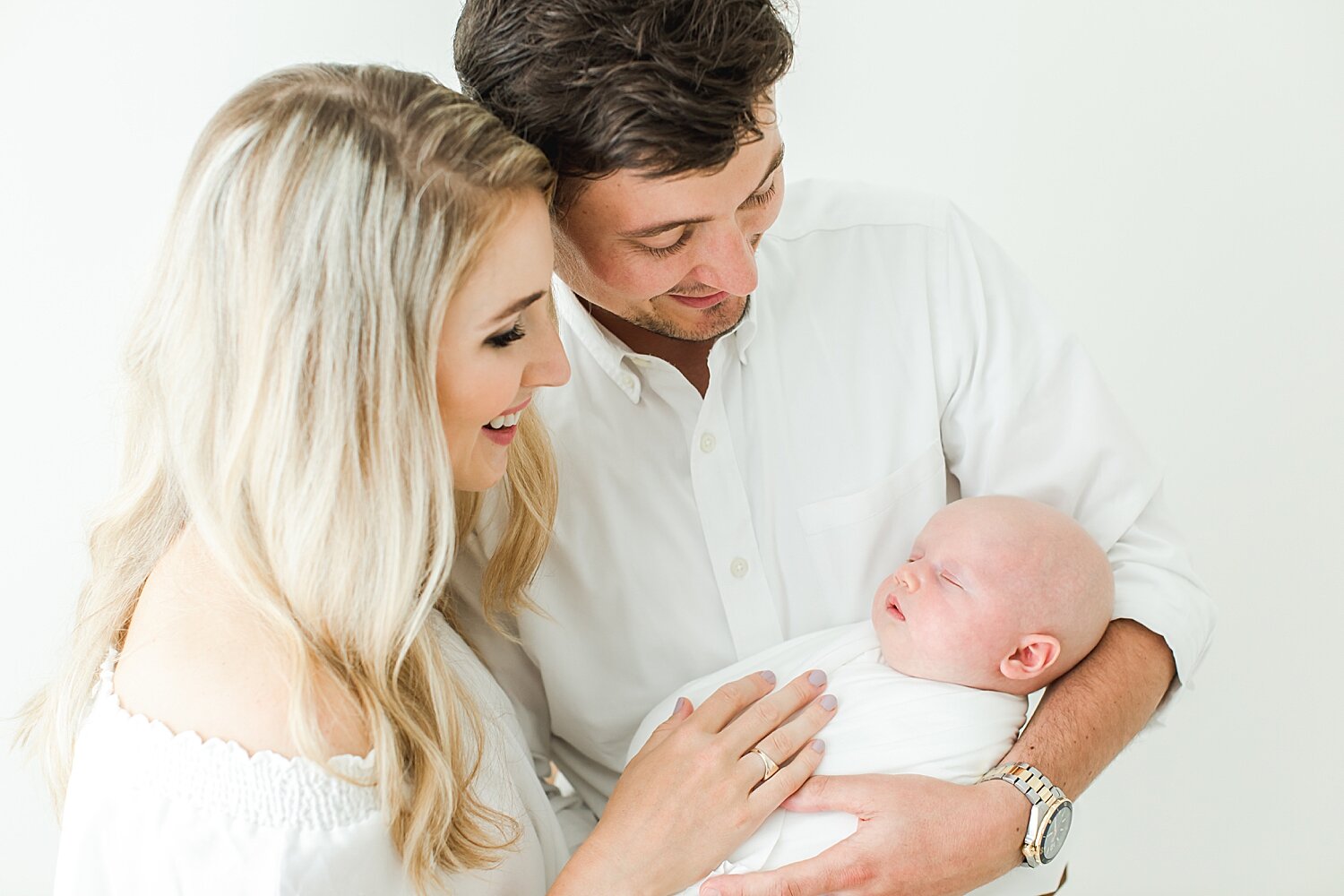 Mom and Dad adoring baby girl. Photos by Greenwich Newborn Photographer, Kristin Wood Photography. 