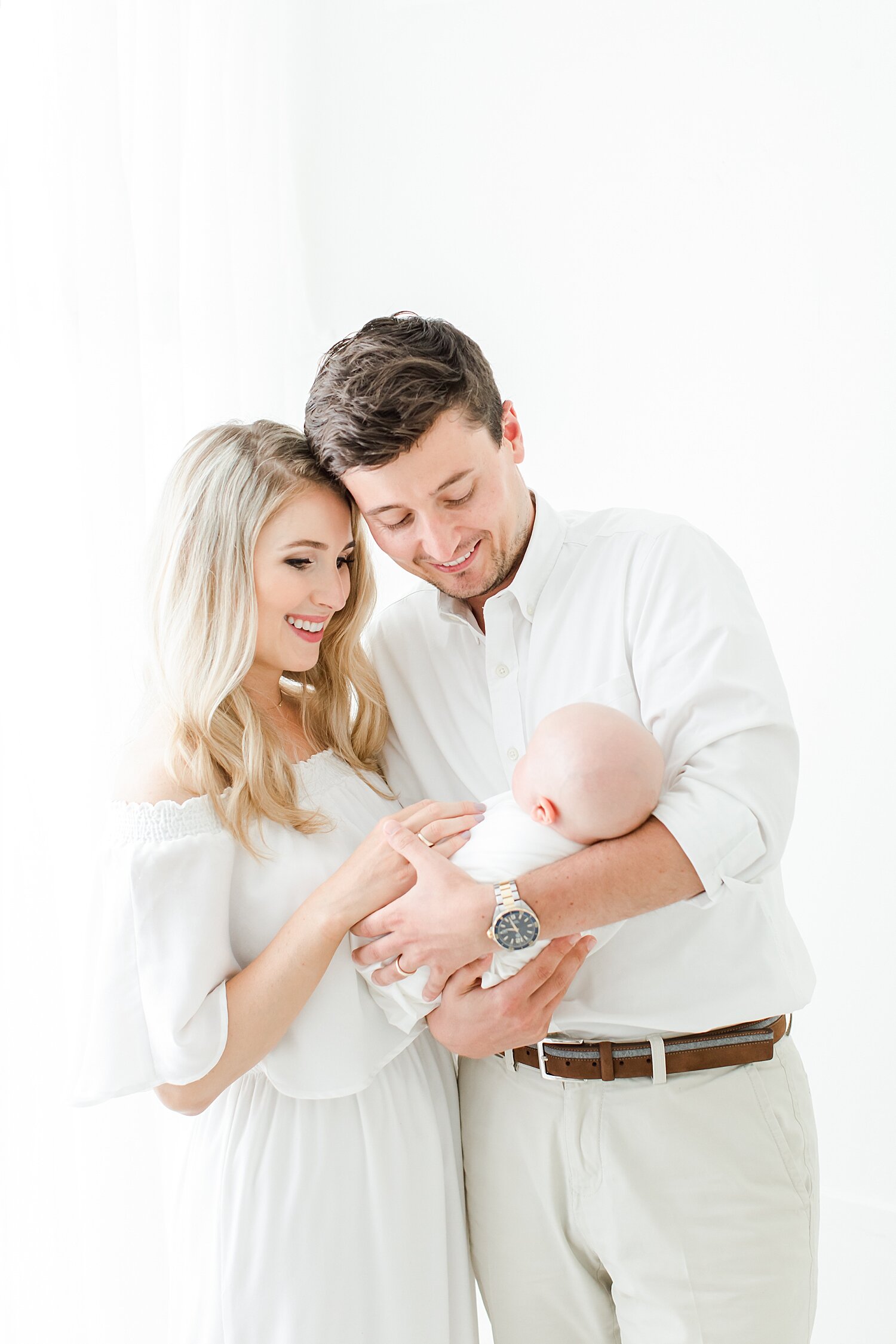 First time parents with baby girl in Darien, CT Newborn Studio. Photos by Kristin Wood Photography. 