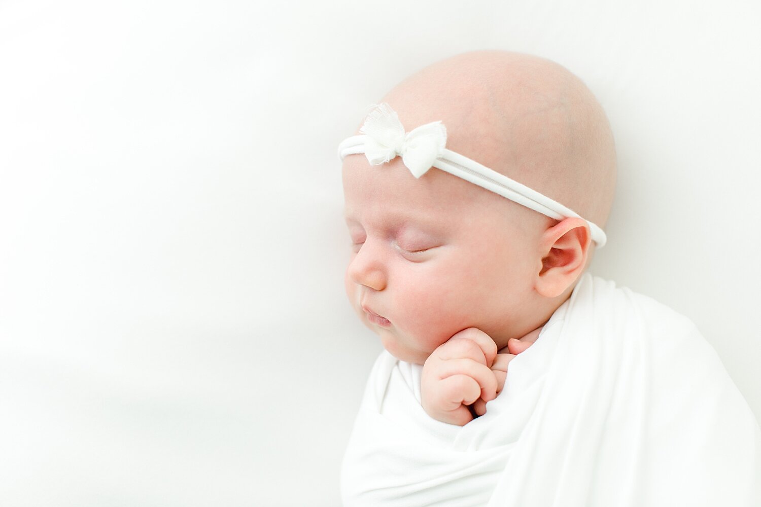 Studio newborn session in Darien, CT with baby girl. Photos by Kristin Wood Photography. 