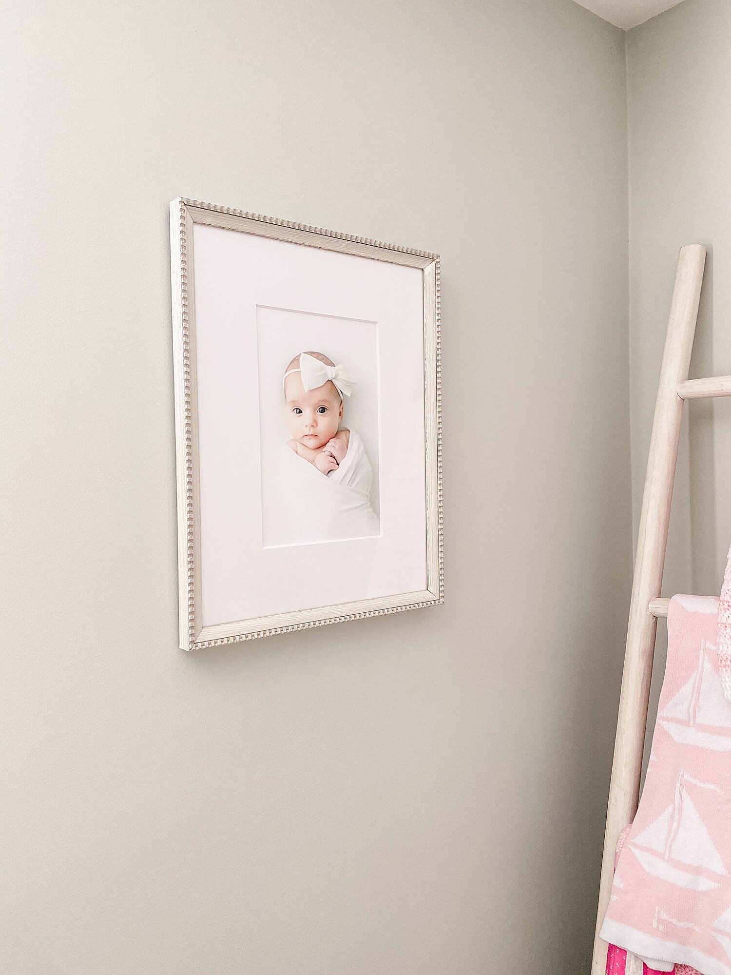 Beautiful newborn photos framed in baby's nursery. Photos and frame installation by Connecticut Newborn Photographer, Kristin Wood Photography.