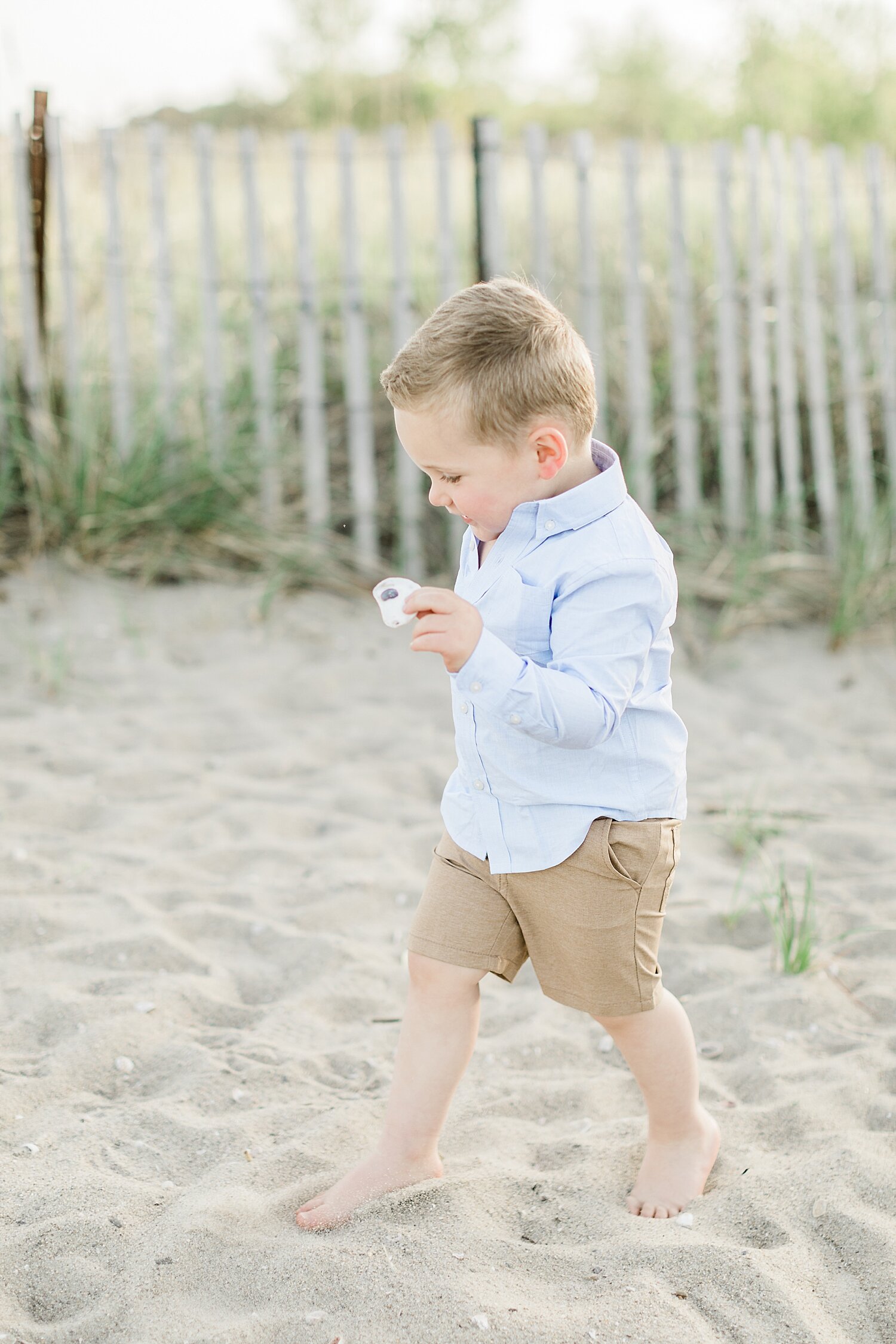Little boy playing in the sand at Sherwood Island. Photos by Kristin Wood Photography.