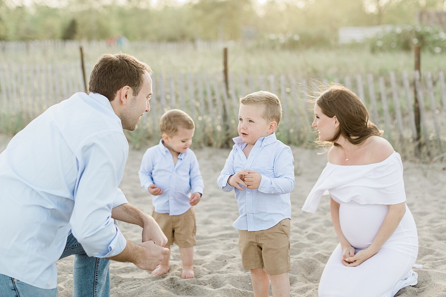 Beach maternity session in Westport, CT with family | Kristin Wood Photography 