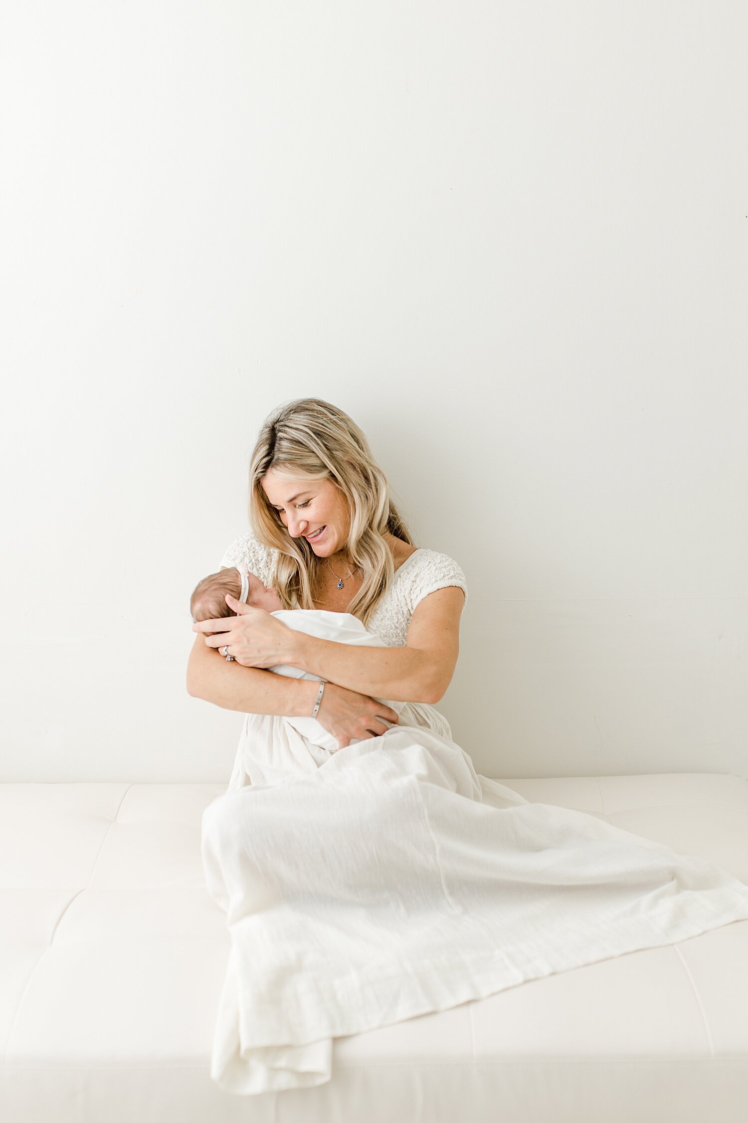 Newborn photographer in Connecticut, Kristin Wood Photography, takes photos of Mom, Dad and newborn baby girl. 