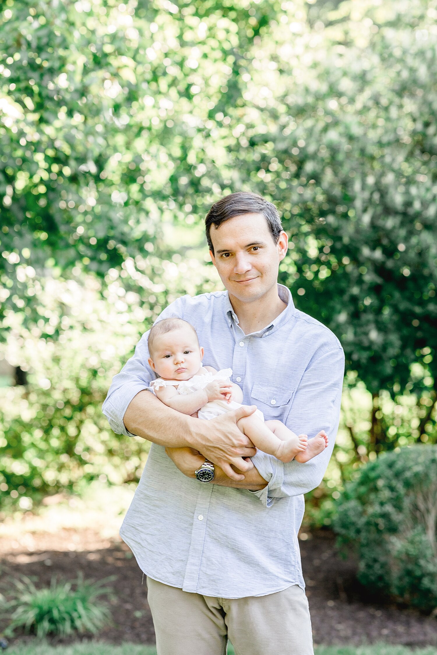 Newborn photo of Dad and baby girl. Photos by Kristin Wood Photography.