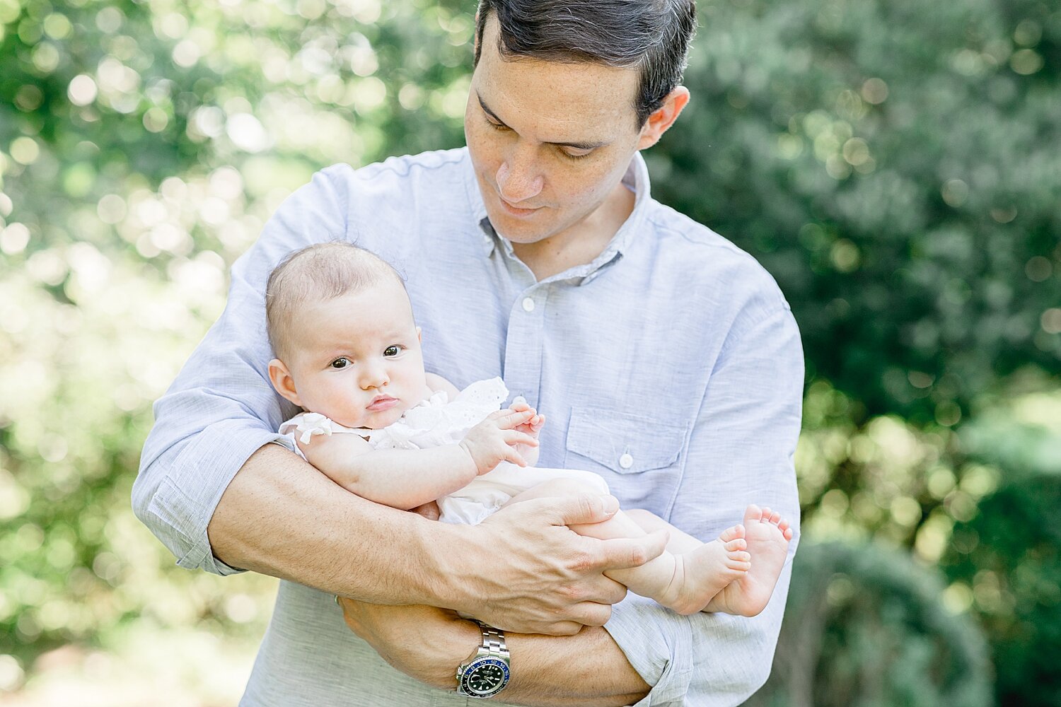 Newborn photo of Dad and baby girl. Photos by Kristin Wood Photography.