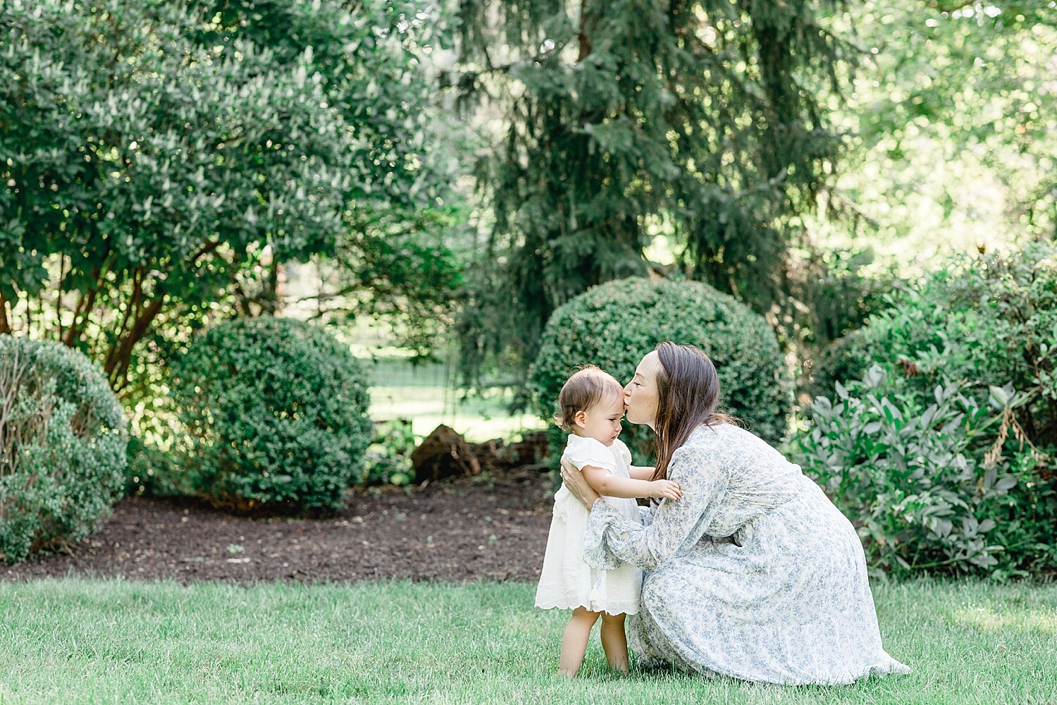 Mom giving daughter a kiss. Photos by Connecticut Photographer, Kristin Wood Photography. 