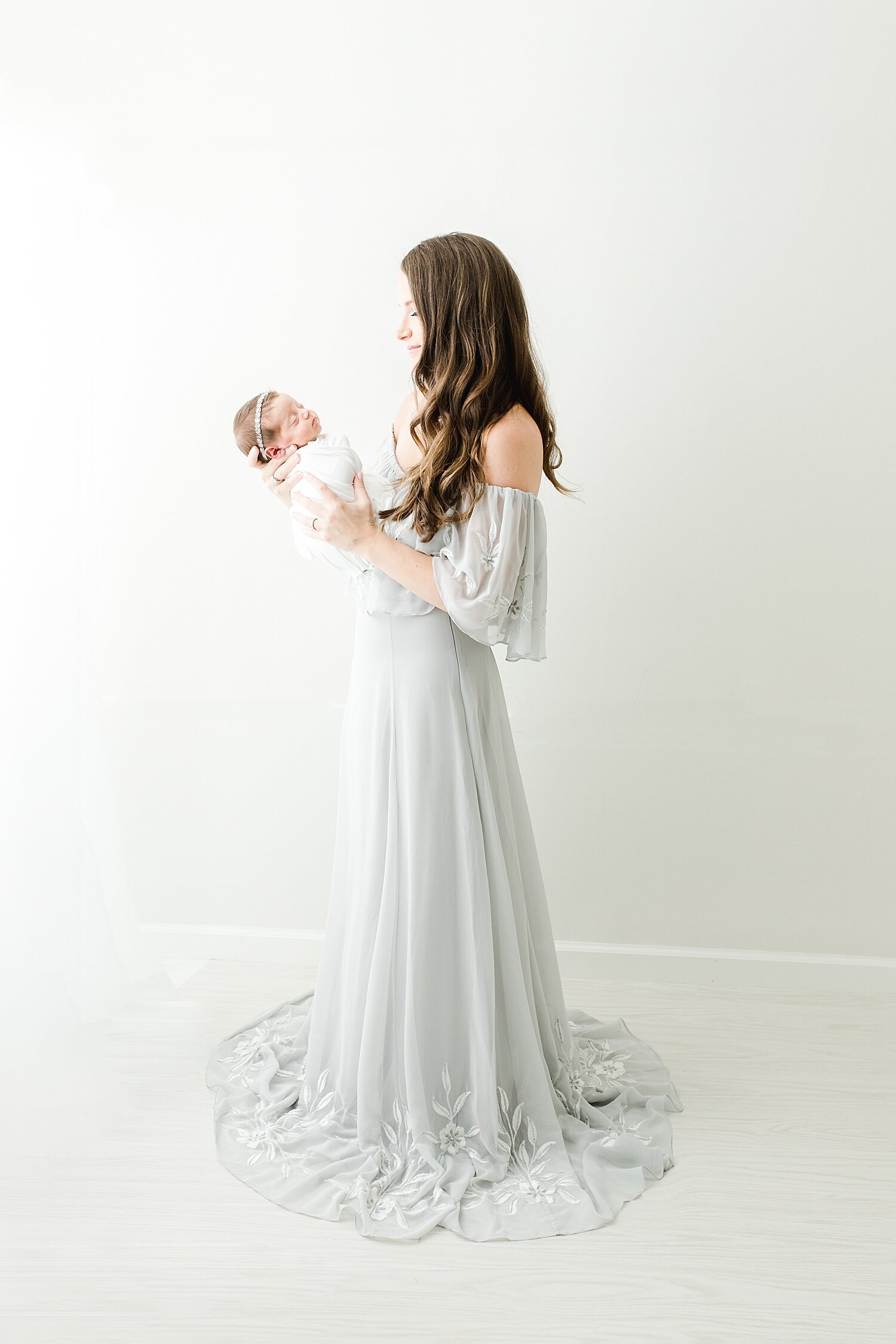 Mom in gorgeous dresses for newborn session with daughter. Photos by Kristin Wood Photography.