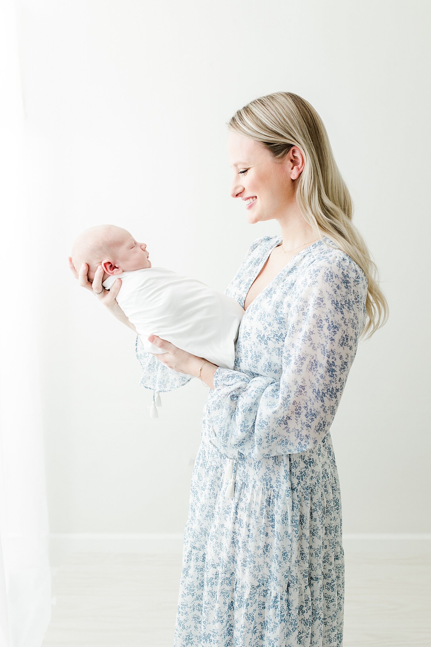 Beautiful photo of first-time mom with baby boy at a newborn studio in Connecticut. Photos by Kristin Wood Photography.