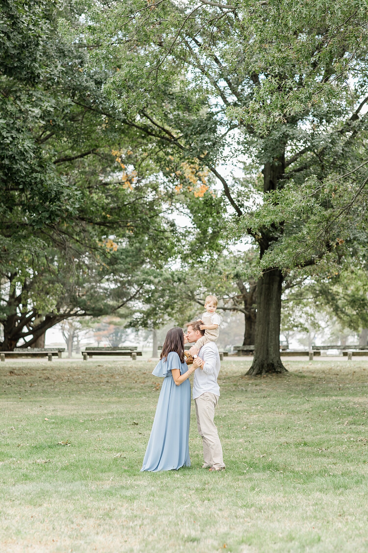 Family photo in field under big tree at Sherwood Island Park. Photos by Kristin Wood Photography.