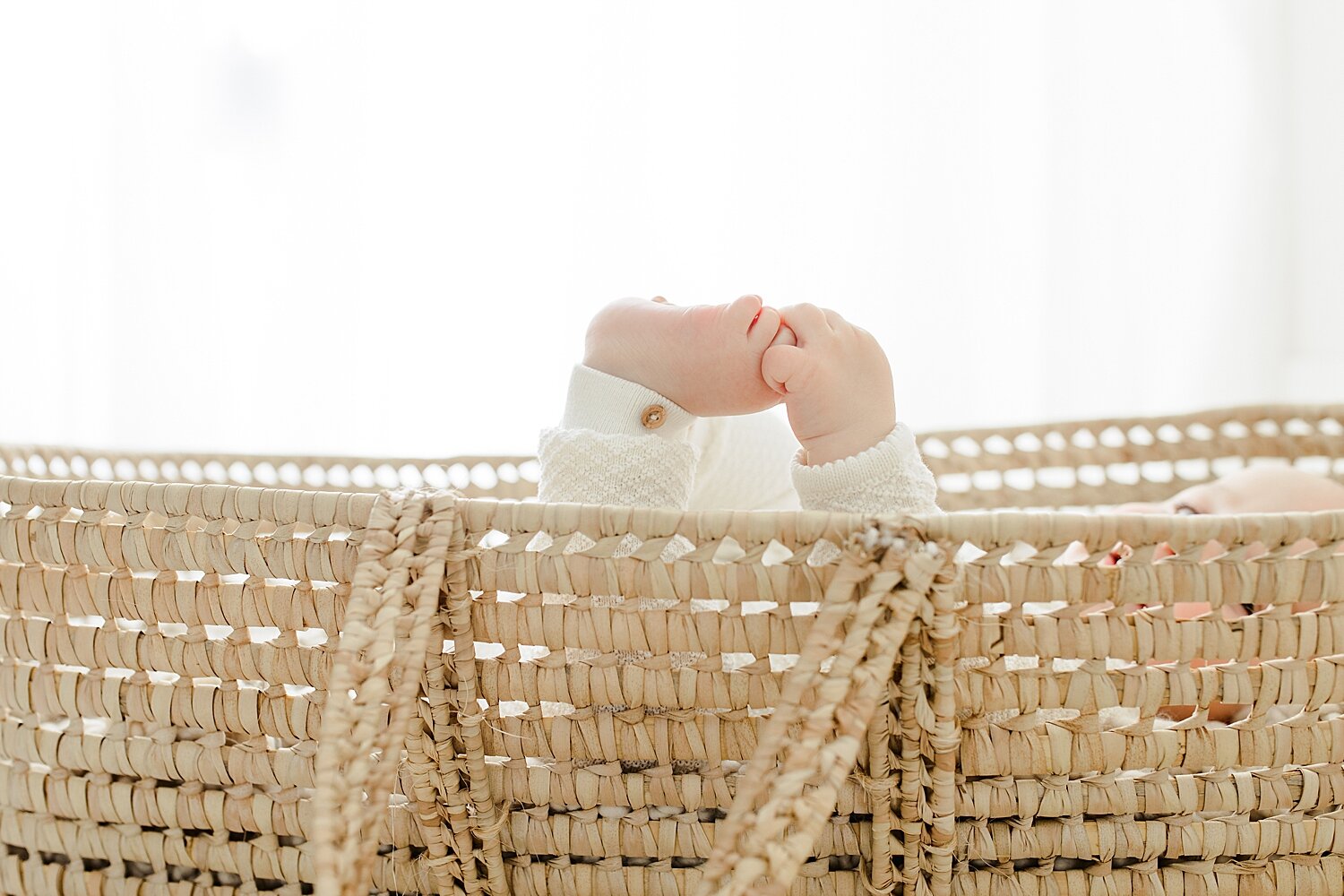 6 month old baby in Moses basket for photoshoot. Photos by Kristin Wood Photography.