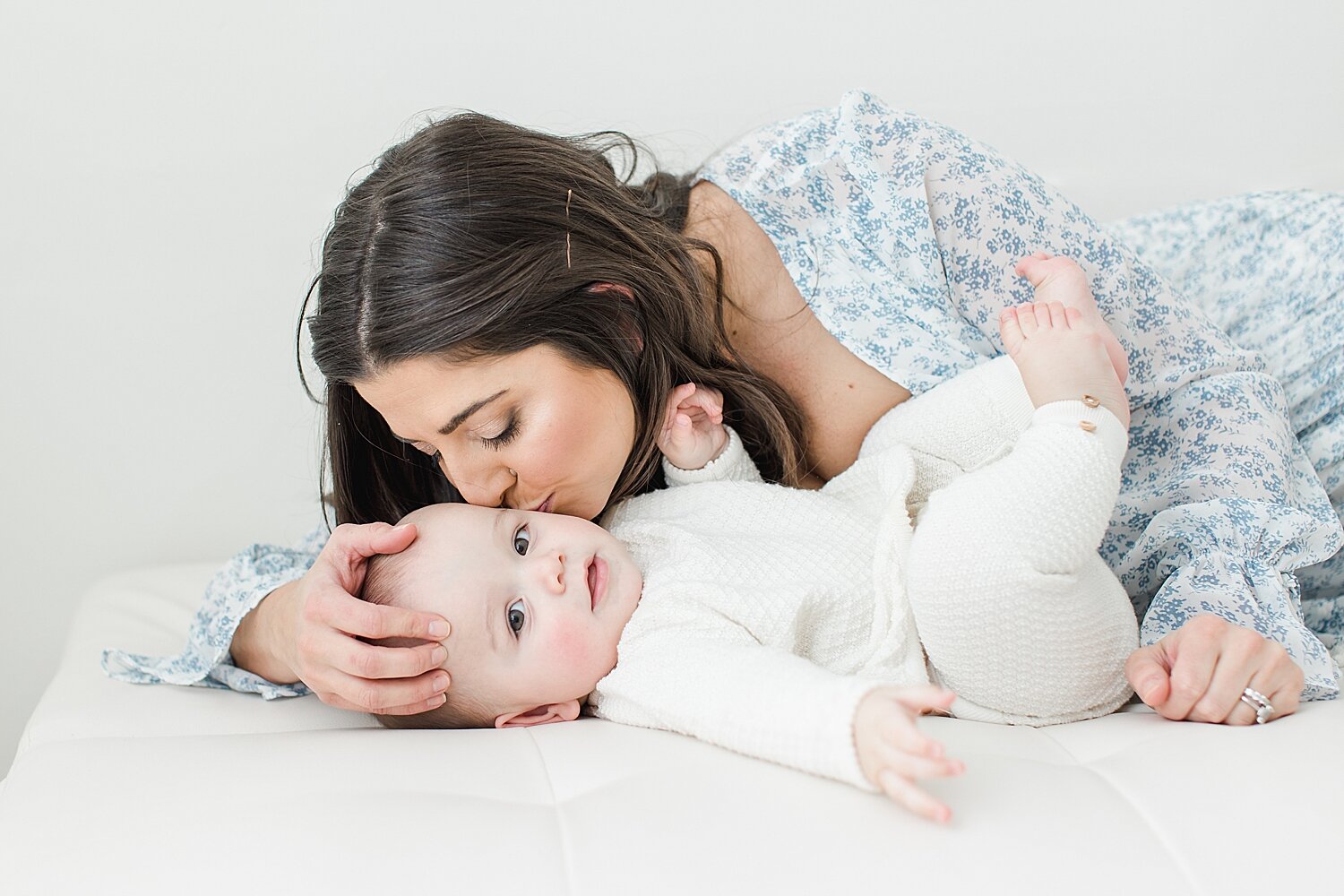 Mom kissing her son during photoshoot with Fairfield County Photographer, Kristin Wood Photography.