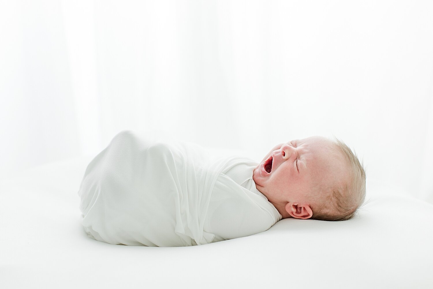 Newborn baby yawns | Kristin Wood Photography