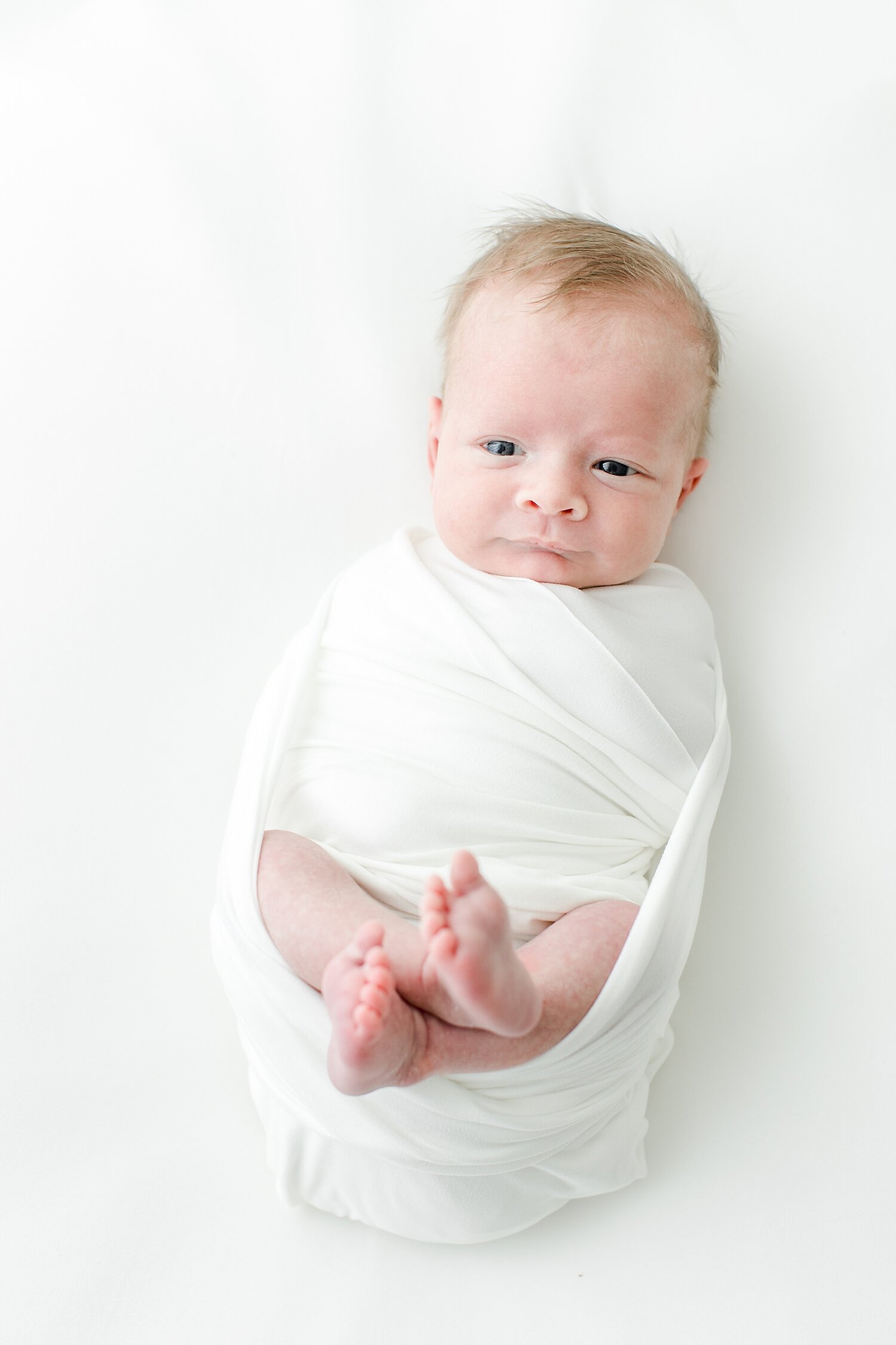 Newborn swaddled and awake for photoshoot with Kristin Wood Photography.