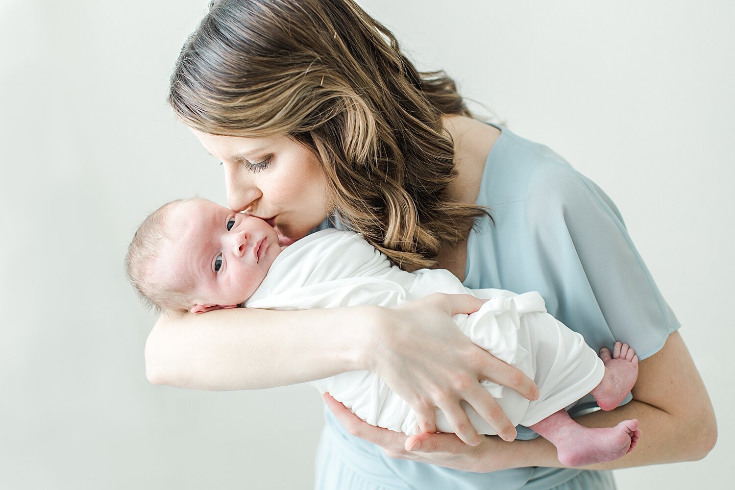 Mom and newborn baby boy. Photos by CT Newborn Photographer, Kristin Wood Photography.
