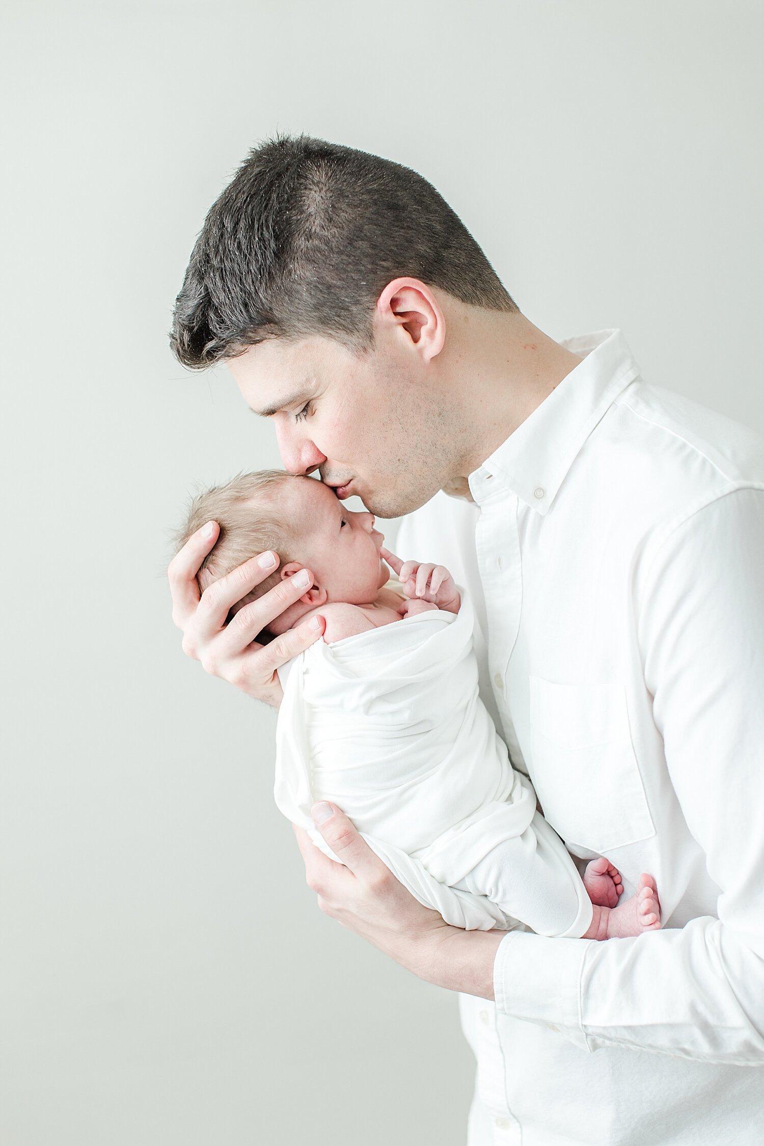 Daddy kissing his son | Kristin Wood Photography