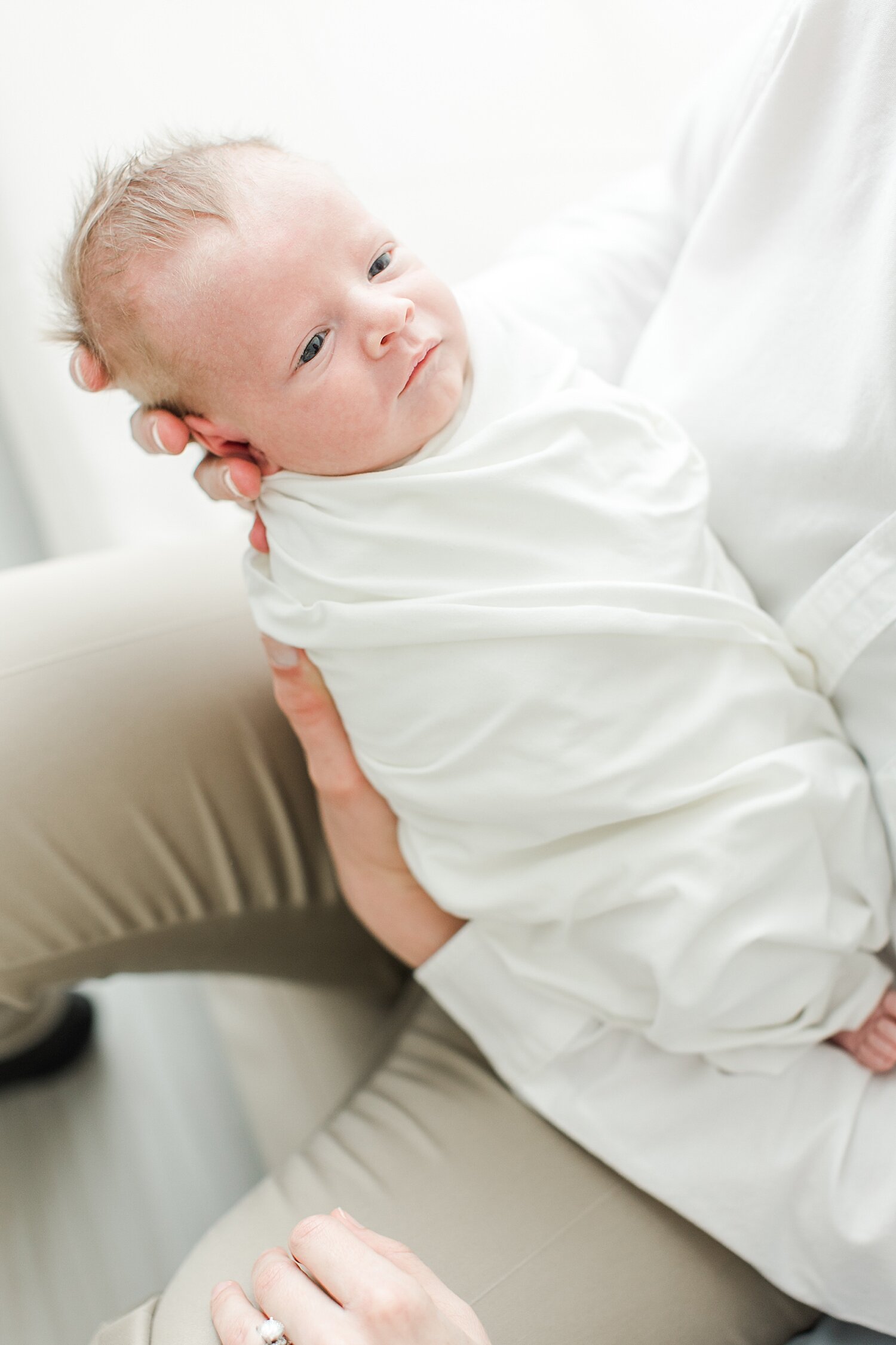 Newborn swaddled in white. Photos by Kristin Wood Photography in Darien, CT.