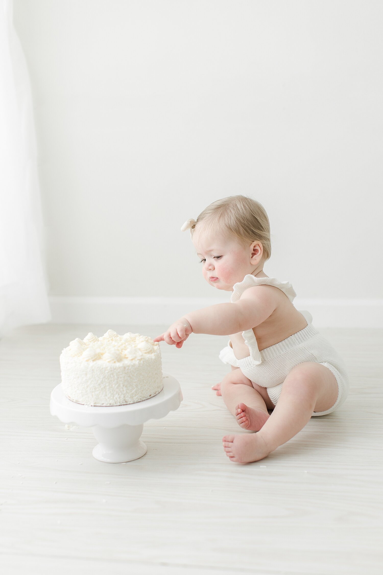 First birthday cake smash in studio in Darien, CT. Photo by Kristin Wood Photography.