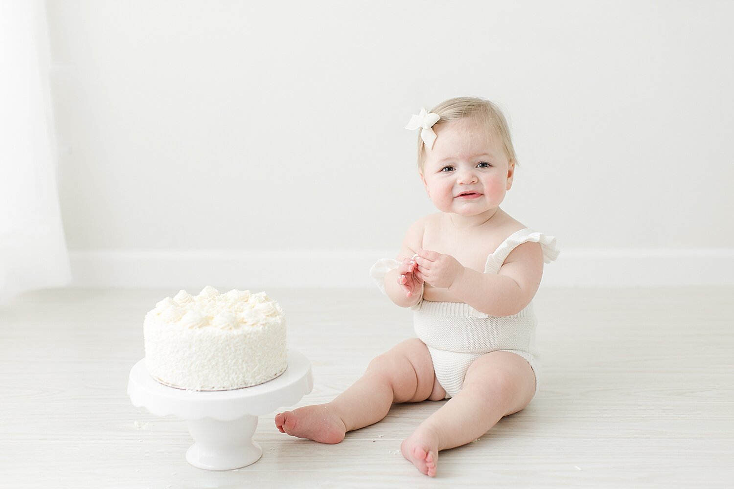 First birthday cake smash in studio in Darien, CT. Photo by Kristin Wood Photography.