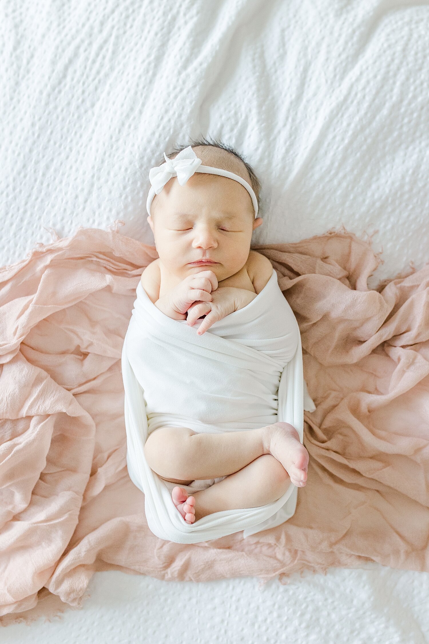 Lifestyle newborn photos of baby girl. Photo by Kristin Wood Photography.