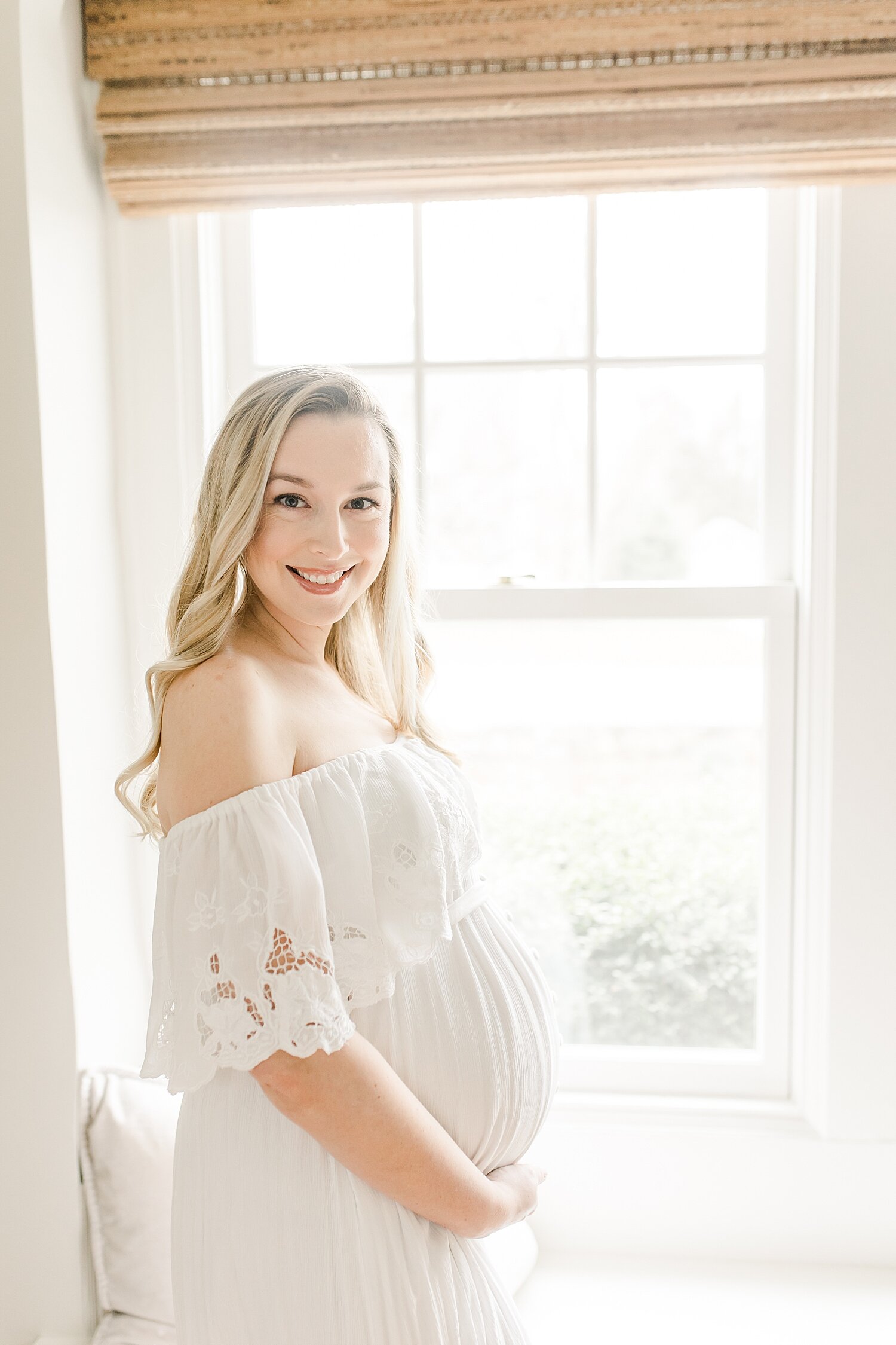 Pregnant mom wearing fillyboo maternity dress. Photo by Kristin Wood Photography.