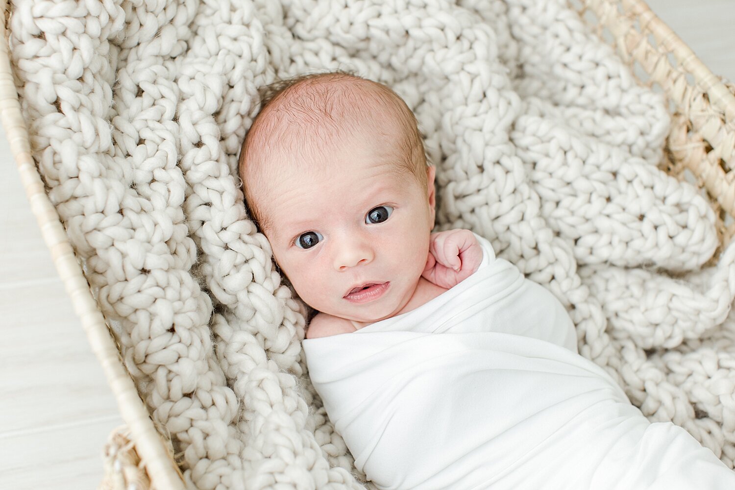 Baby boy in Moses basket for newborn photos | Kristin Wood Photography