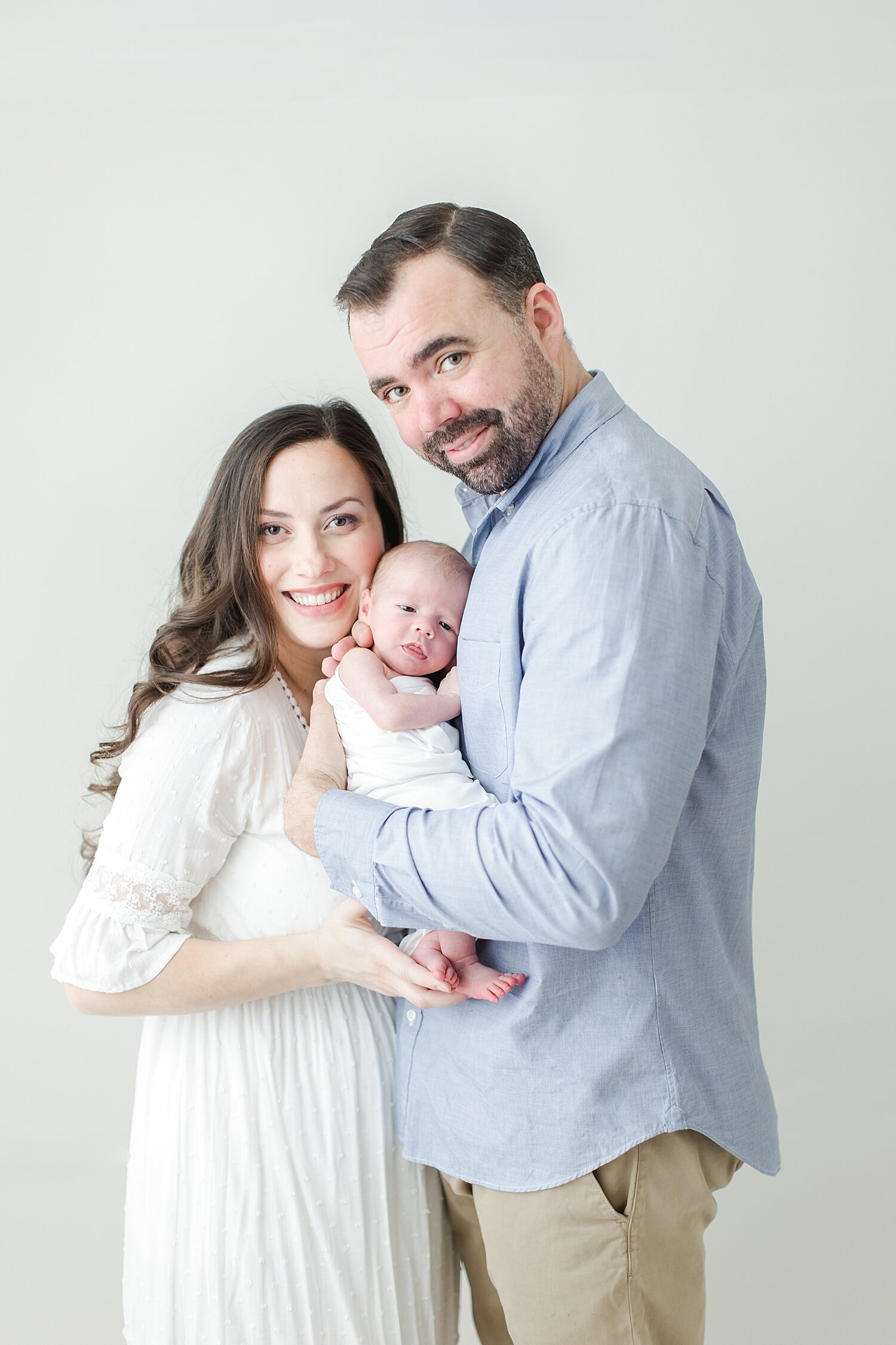 Family portrait during newborn session in studio in Fairfield County, CT. Photo by Kristin Wood Photography.