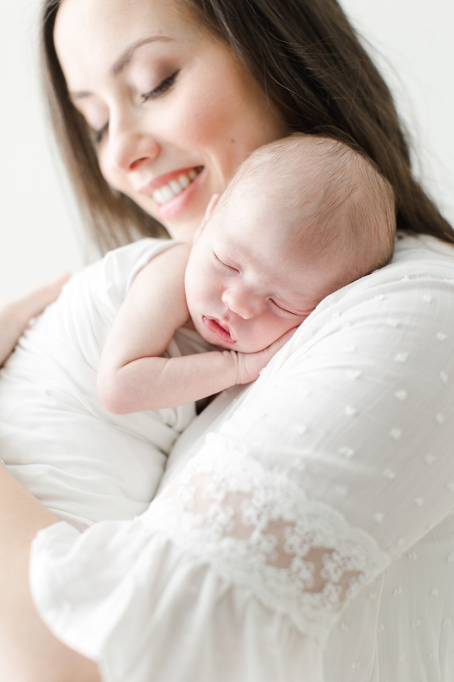 Baby boy laying on moms shoulder during newborn session | Kristin Wood Photography