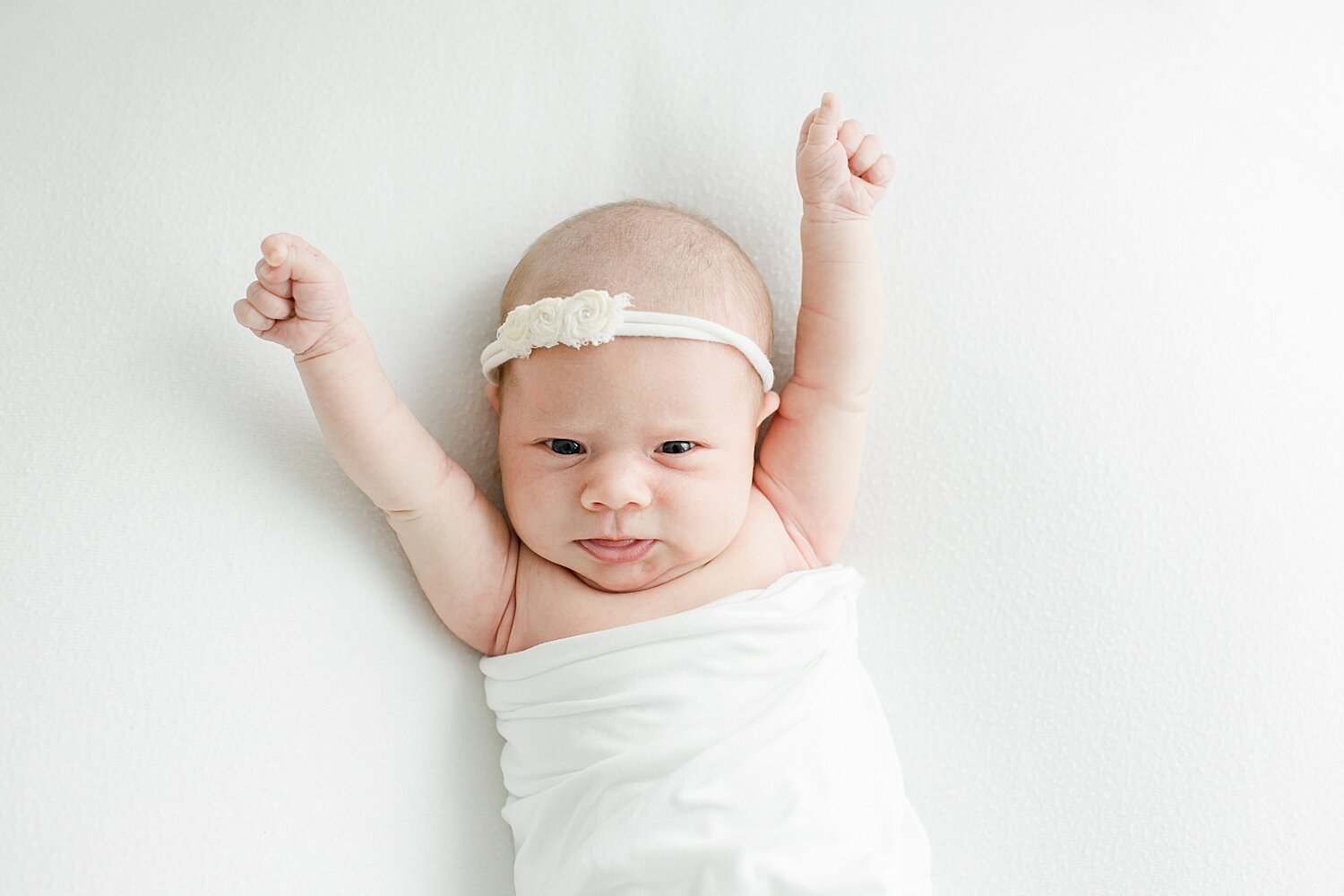 Newborn photos with baby girl in photography studio in Westport with Kristin Wood Photography.