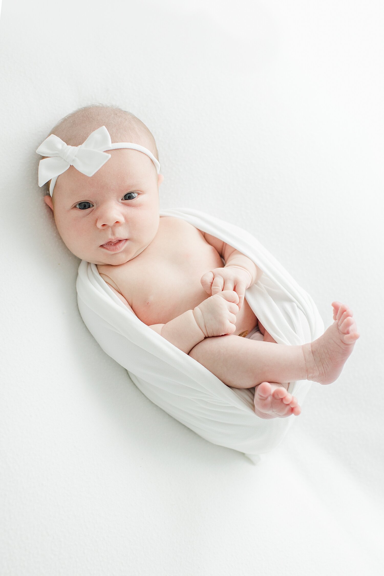 Newborn photos with baby girl in photography studio in Westport with Kristin Wood Photography.