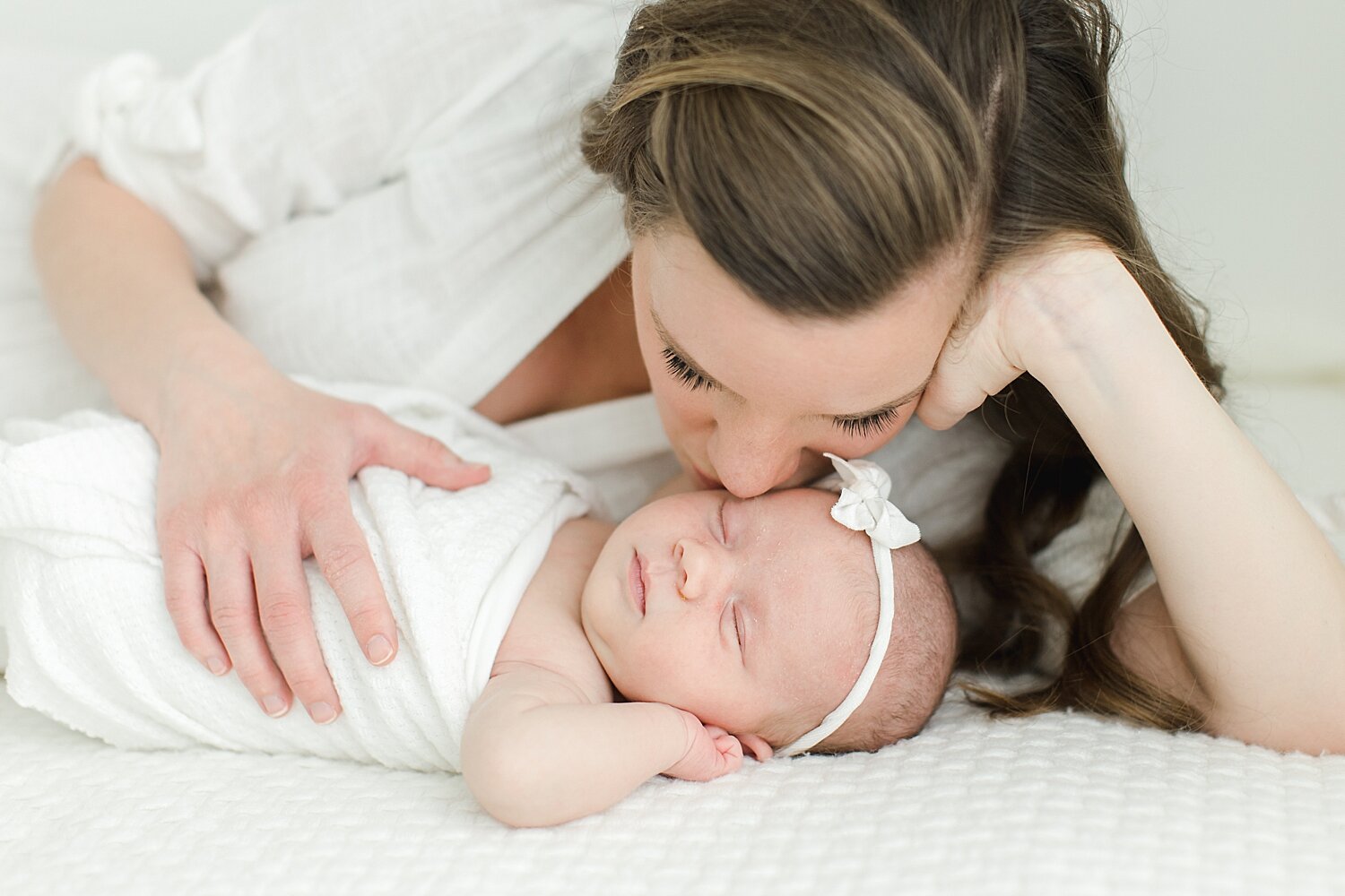 Mom kissing baby girl | Kristin Wood Photography