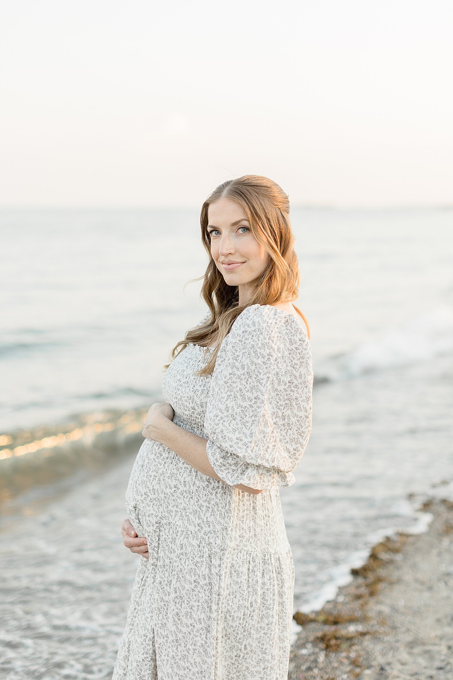 Mom on the beach in Westport for maternity photos with Kristin Wood Photography.