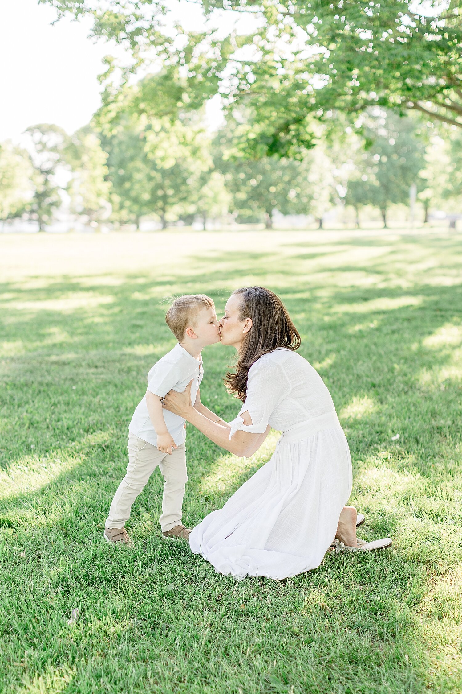 Mom giving son a kiss | Kristin Wood Photography