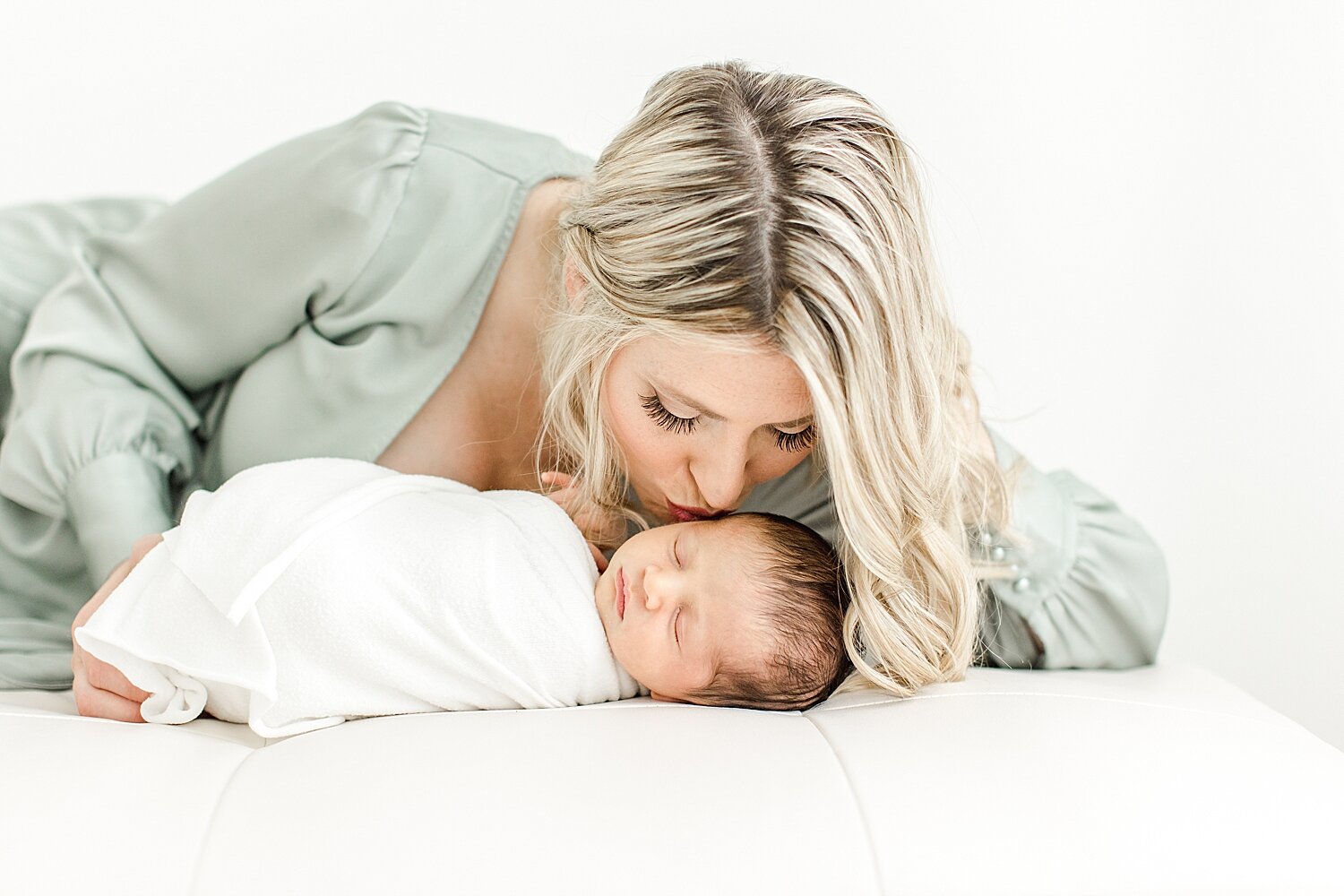 Newborn photos of mom and her son. Photo by CT Newborn Photographer, Kristin Wood Photography.