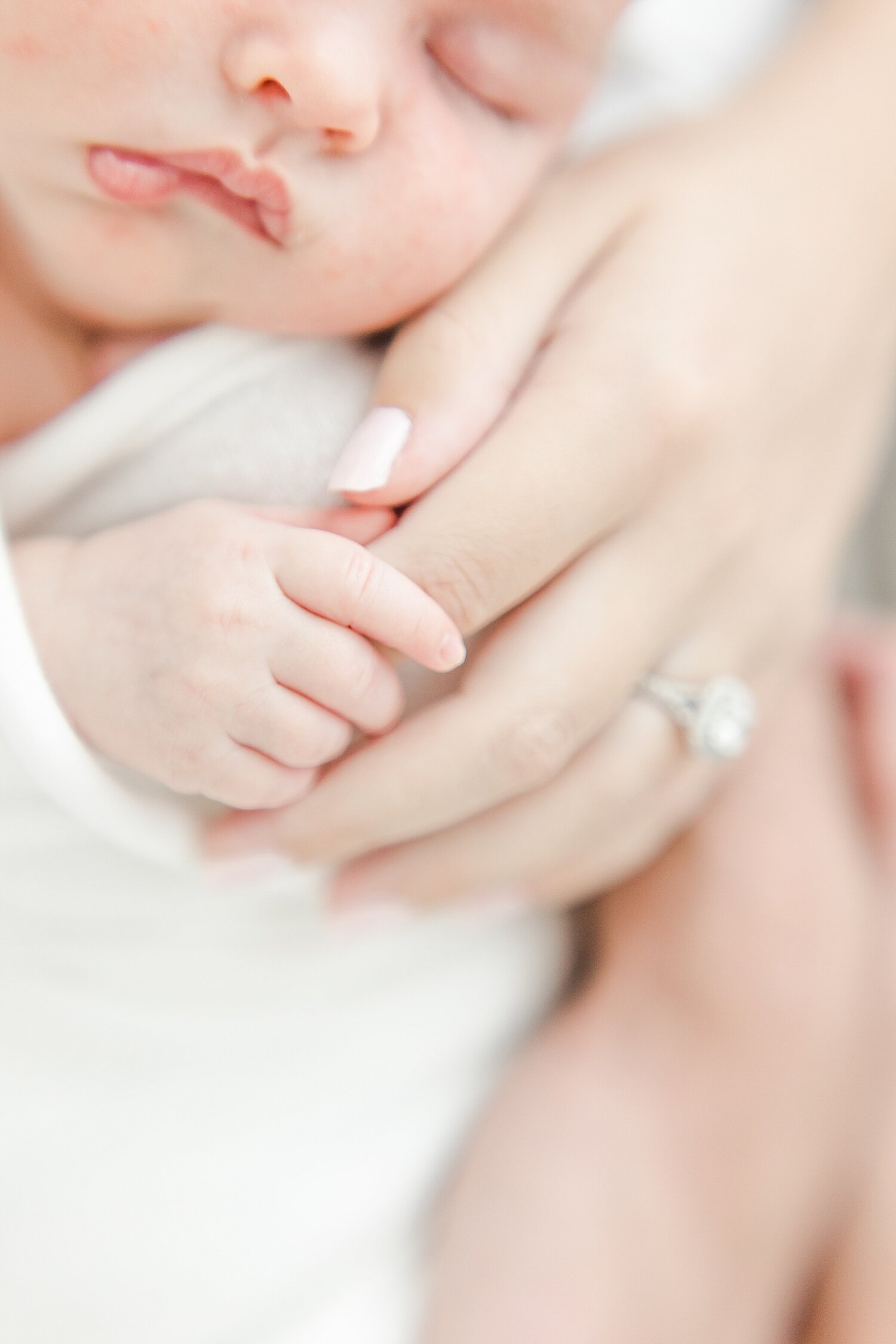 Mom holding baby girl's hand | Kristin Wood Photography