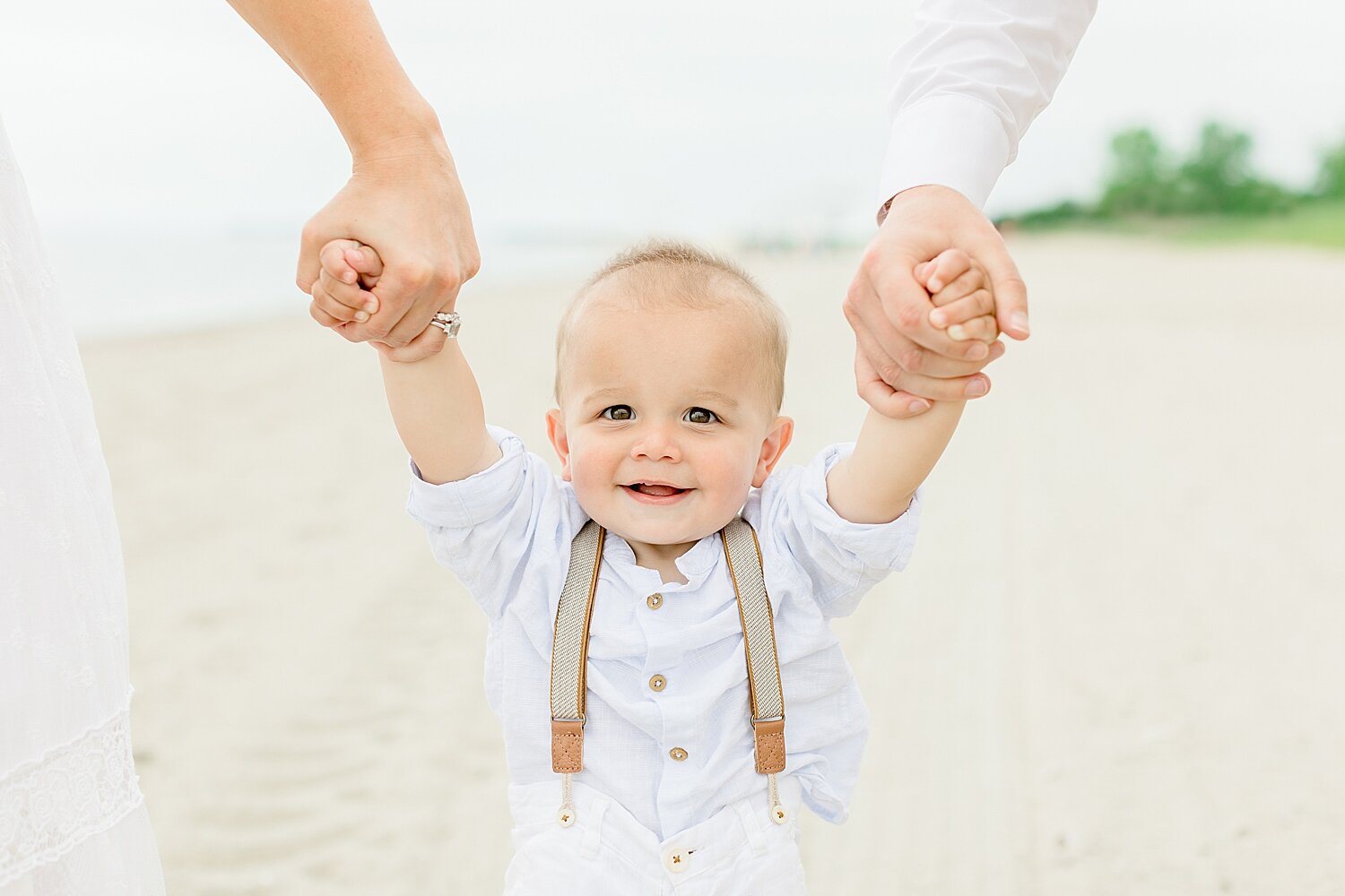One year old photos with little boy wearing suspenders | Kristin Wood Photography