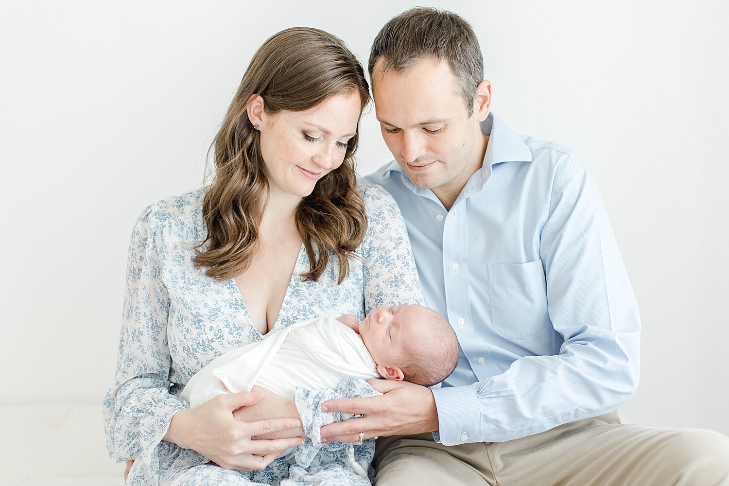Newborn session in studio with first-time parents and baby boy. Photo by Kristin Wood Photography.