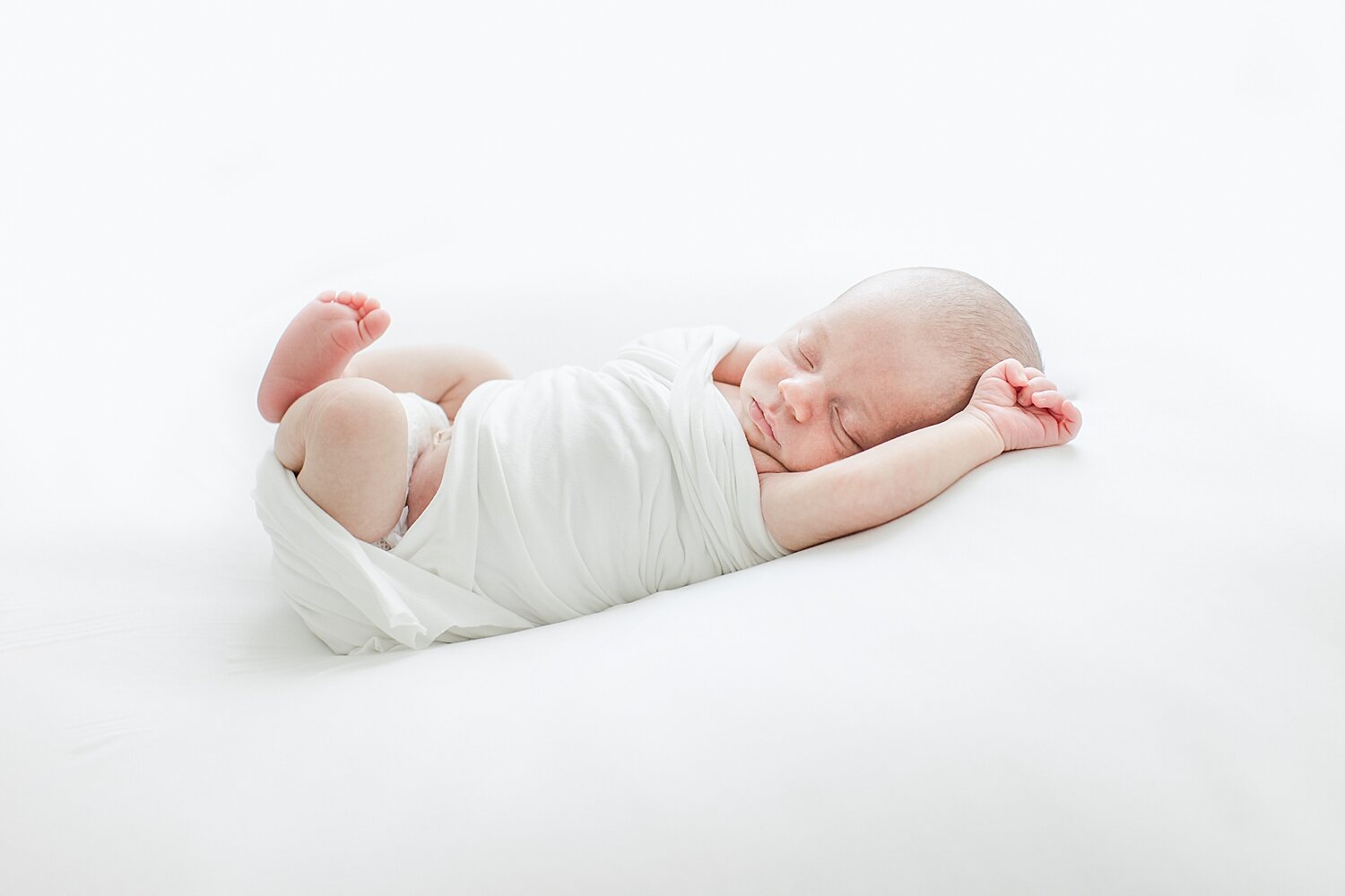 Newborn baby stretched out | Kristin Wood Photography