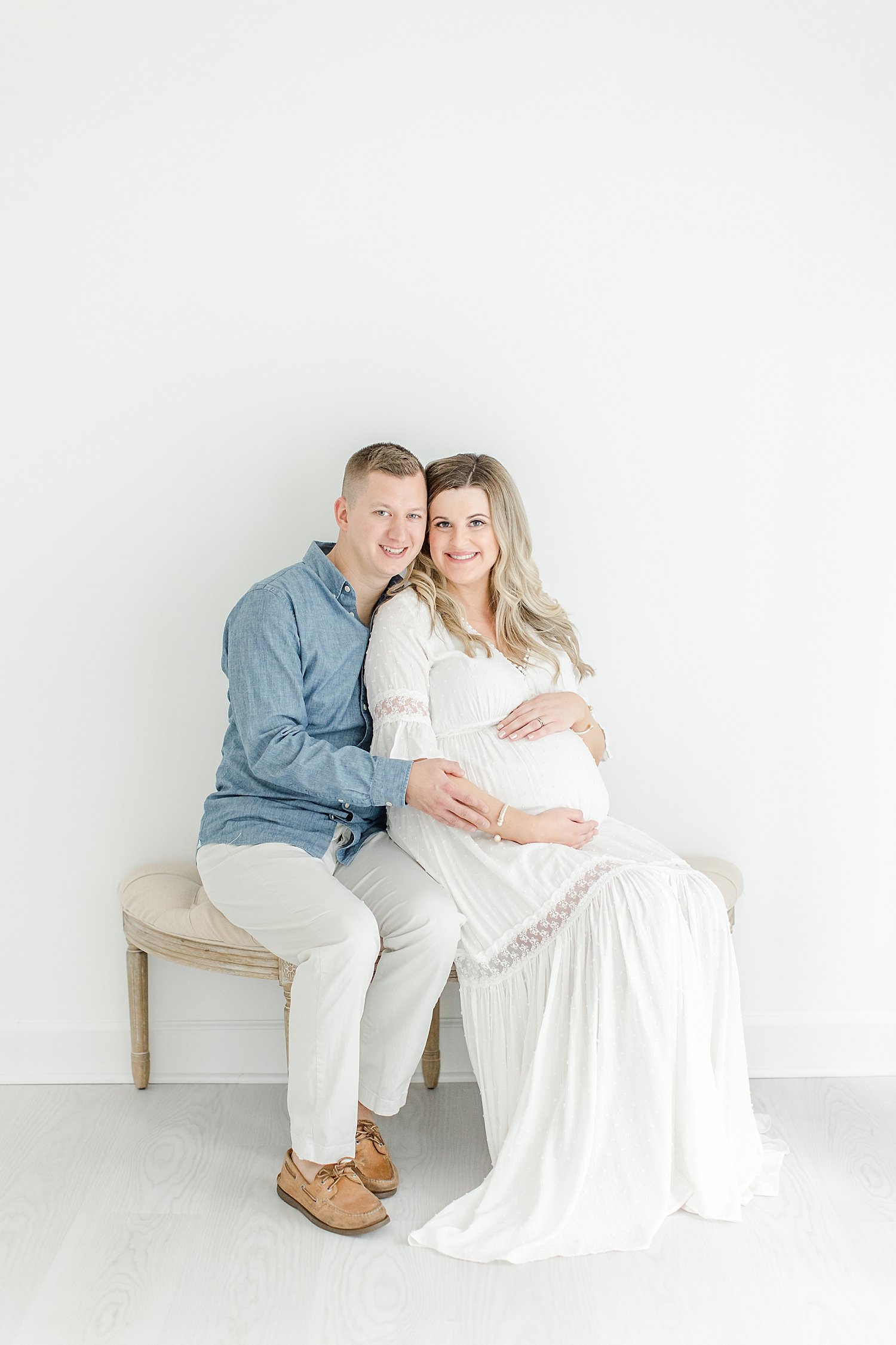 Expecting parents sitting for maternity photos | Kristin Wood Photography
