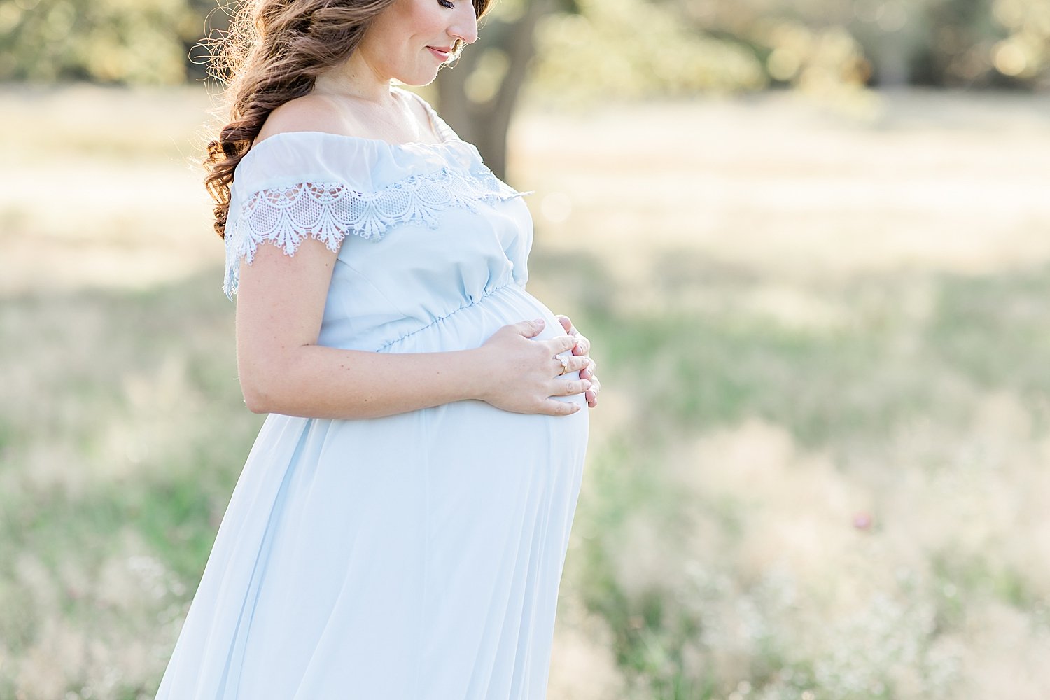 Why You Should Hire a Photographer for Your Baby's First Year | Maternity photo in field at Waveny Park in CT | Kristin Wood Photography