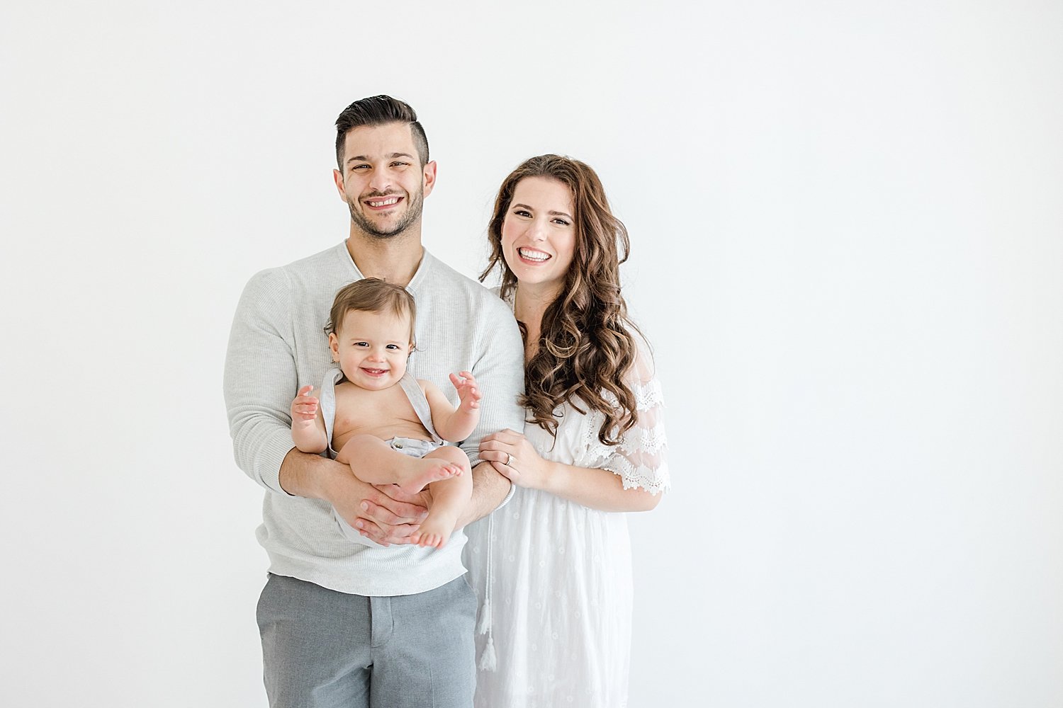 Why You Should Hire a Photographer for Your Baby's First Year | Parents with son during first birthday photoshoot | Kristin Wood Photography