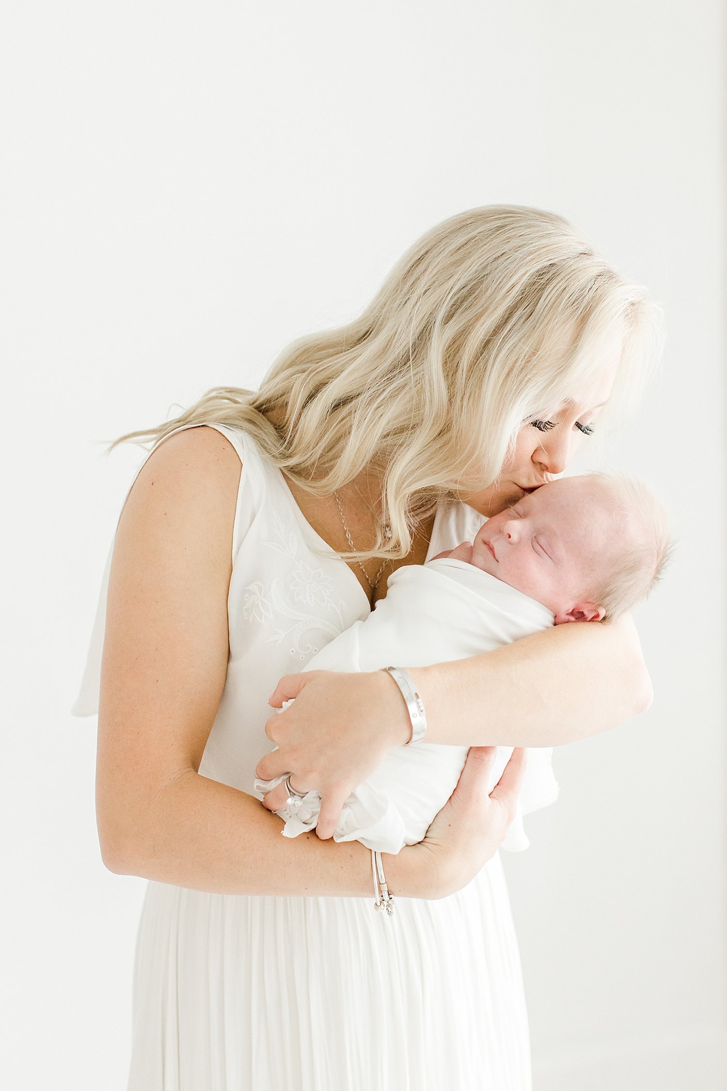 Mom kissing her baby boy | Kristin Wood Photography