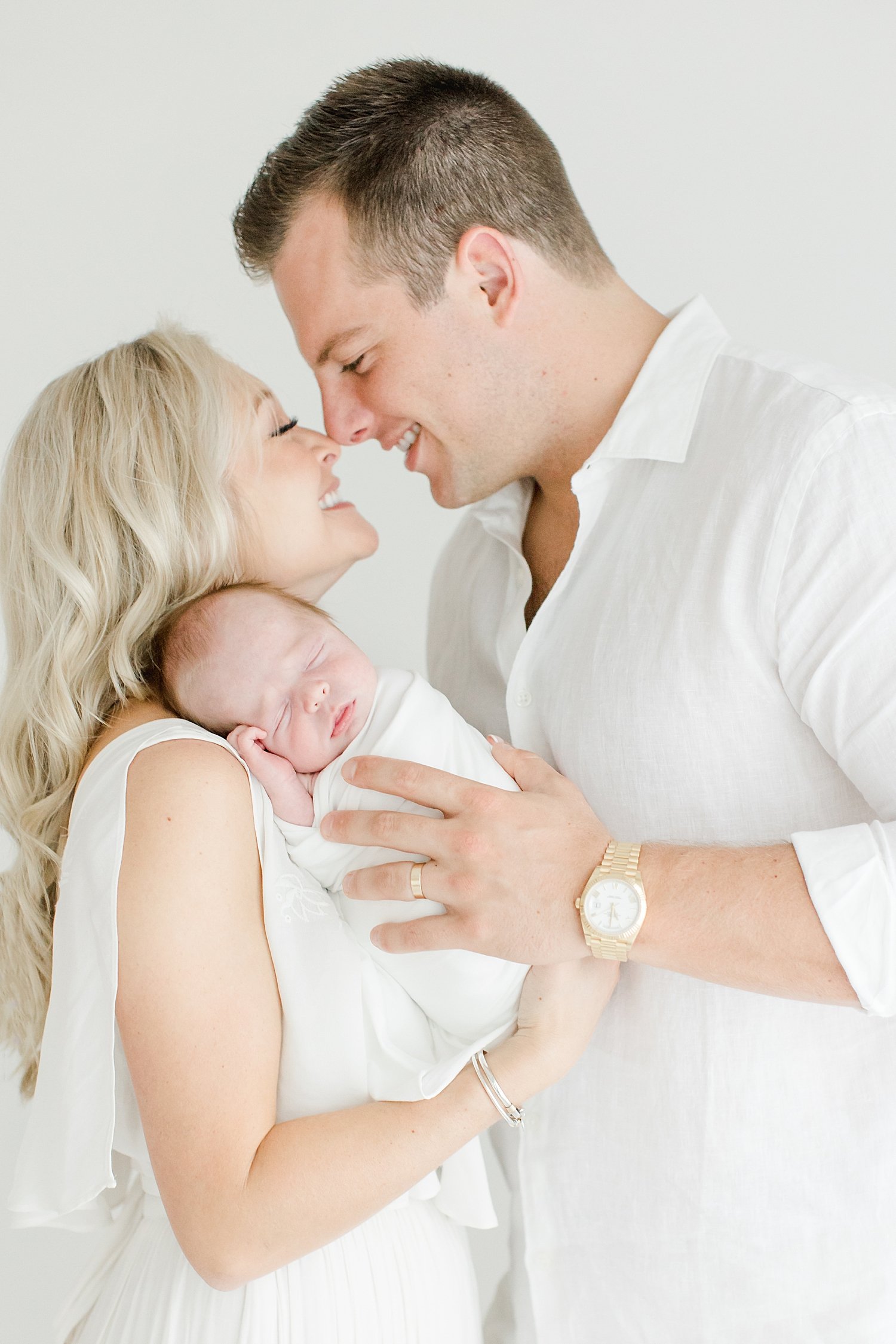 Parents nose to nose overlooking their newborn baby boy | Kristin Wood Photography