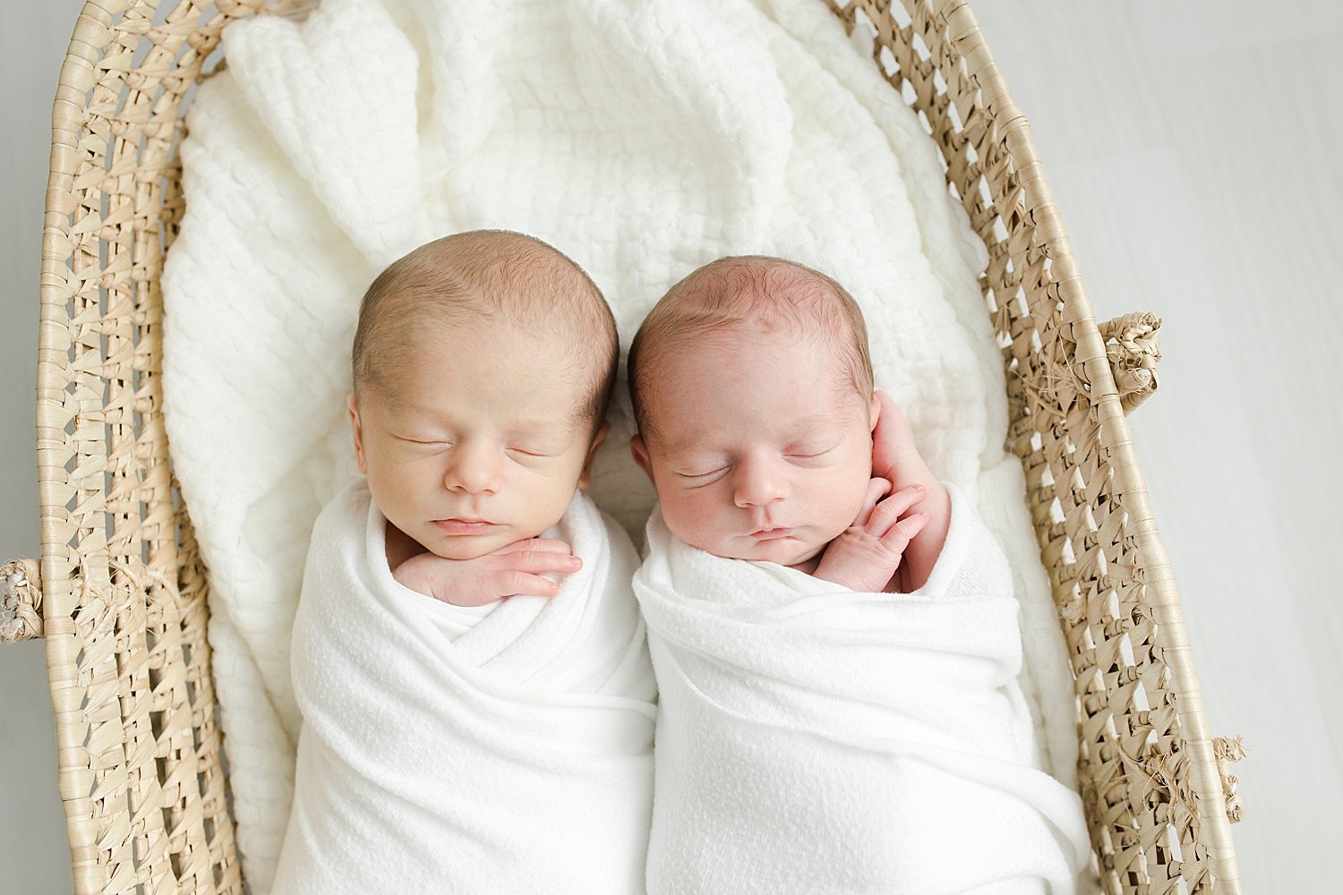 Twin newborn photos in Moses basket | Kristin Wood Photography